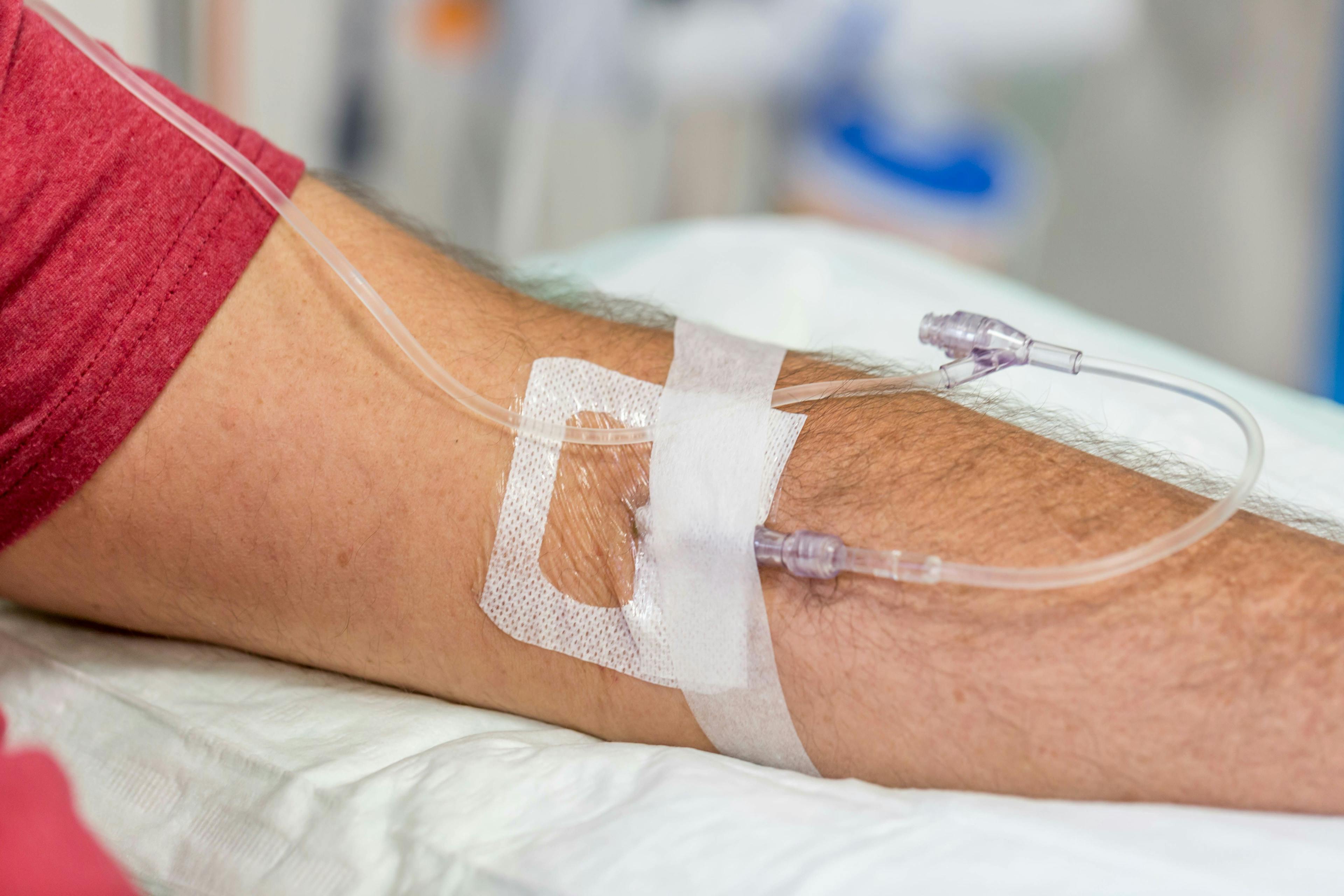 man in hospital having an intravenous drip immunoglobulin infusion