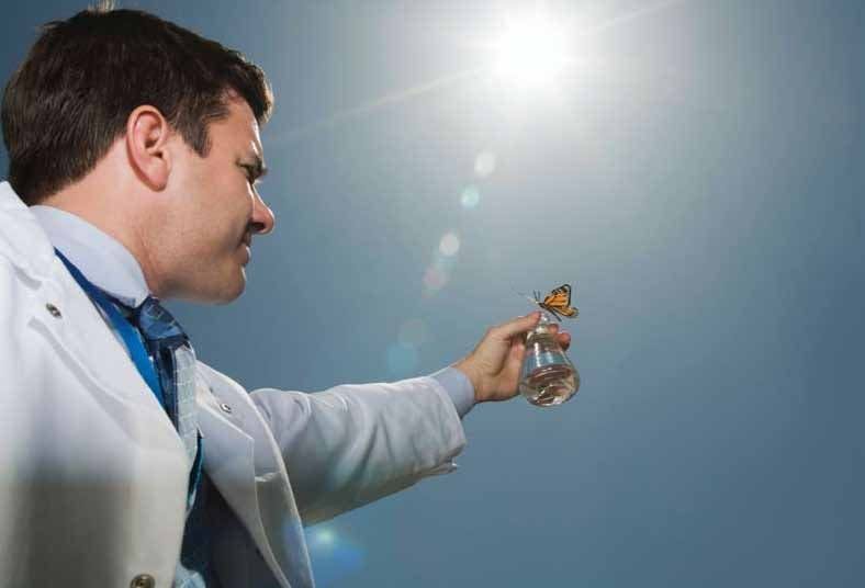 Pharmacist with beaker and butterfly