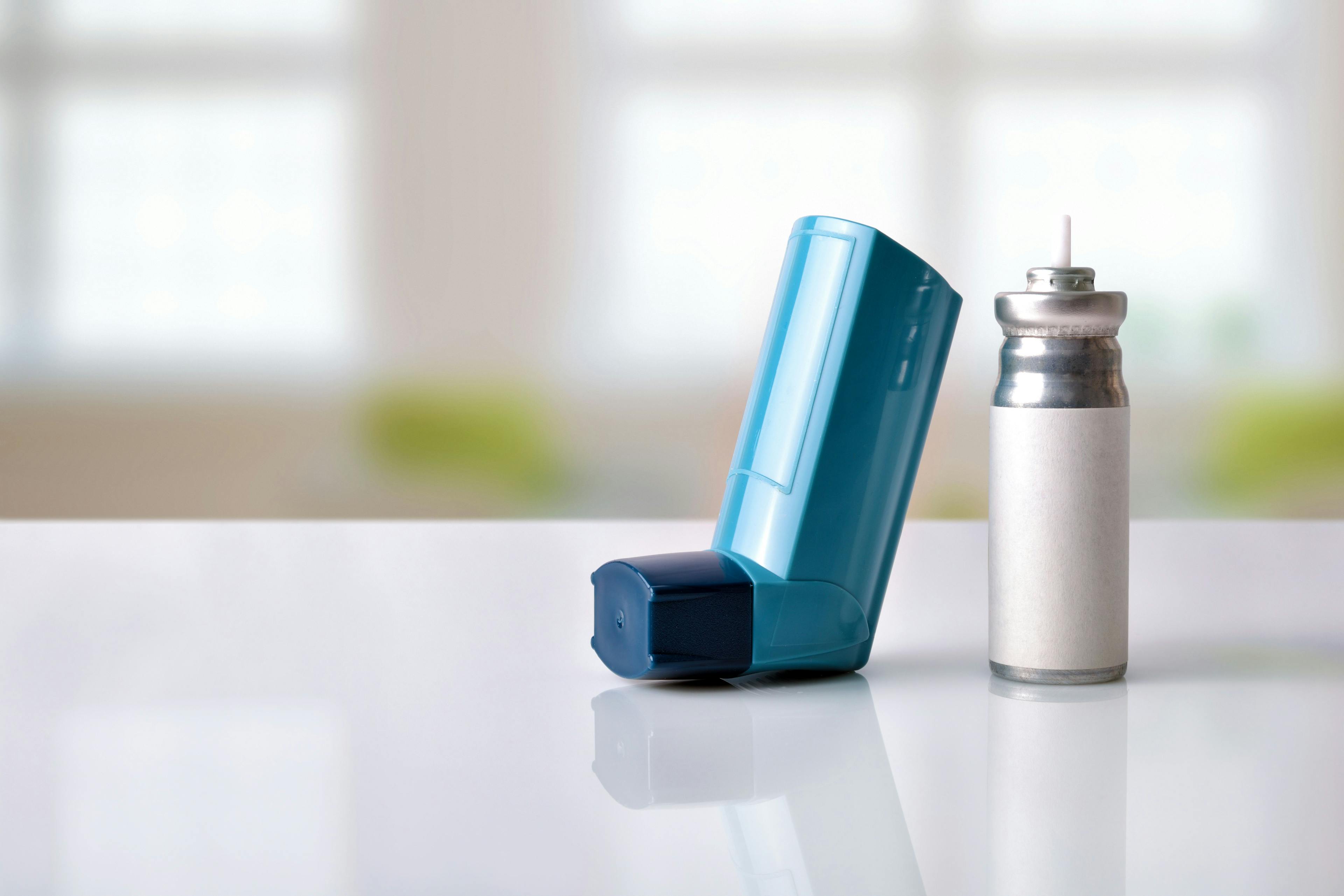 Cartridge and blue medicine inhaler in a room front view | Image Credit: Davizro Photography - stock.adobe.com