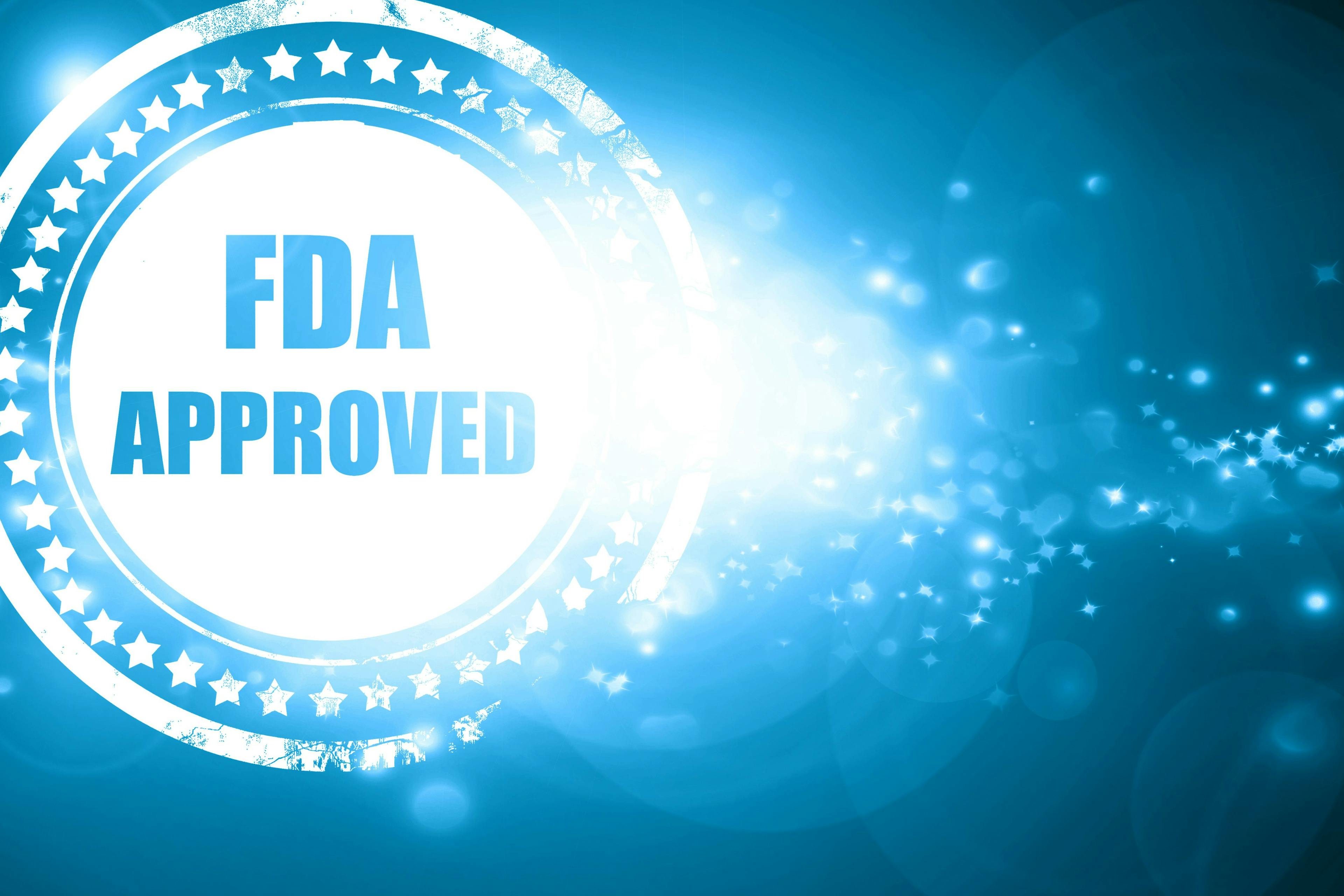 Blue stamp on a glittering background FDA Approved | Image Credit: Argus - stock.adobe.com