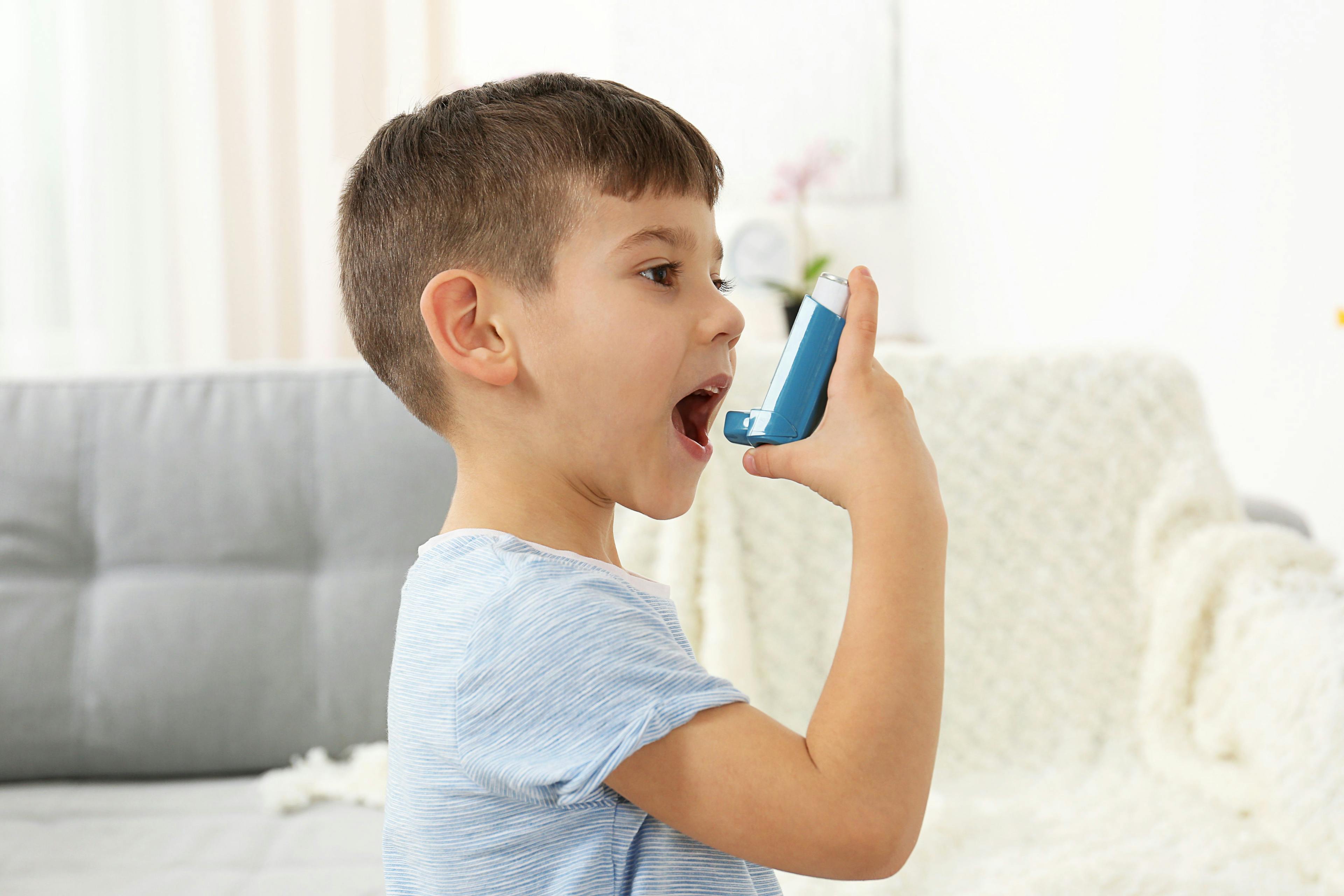 Boy using asthma inhaler -- Image credit: Africa Studio | stock.adobe.com