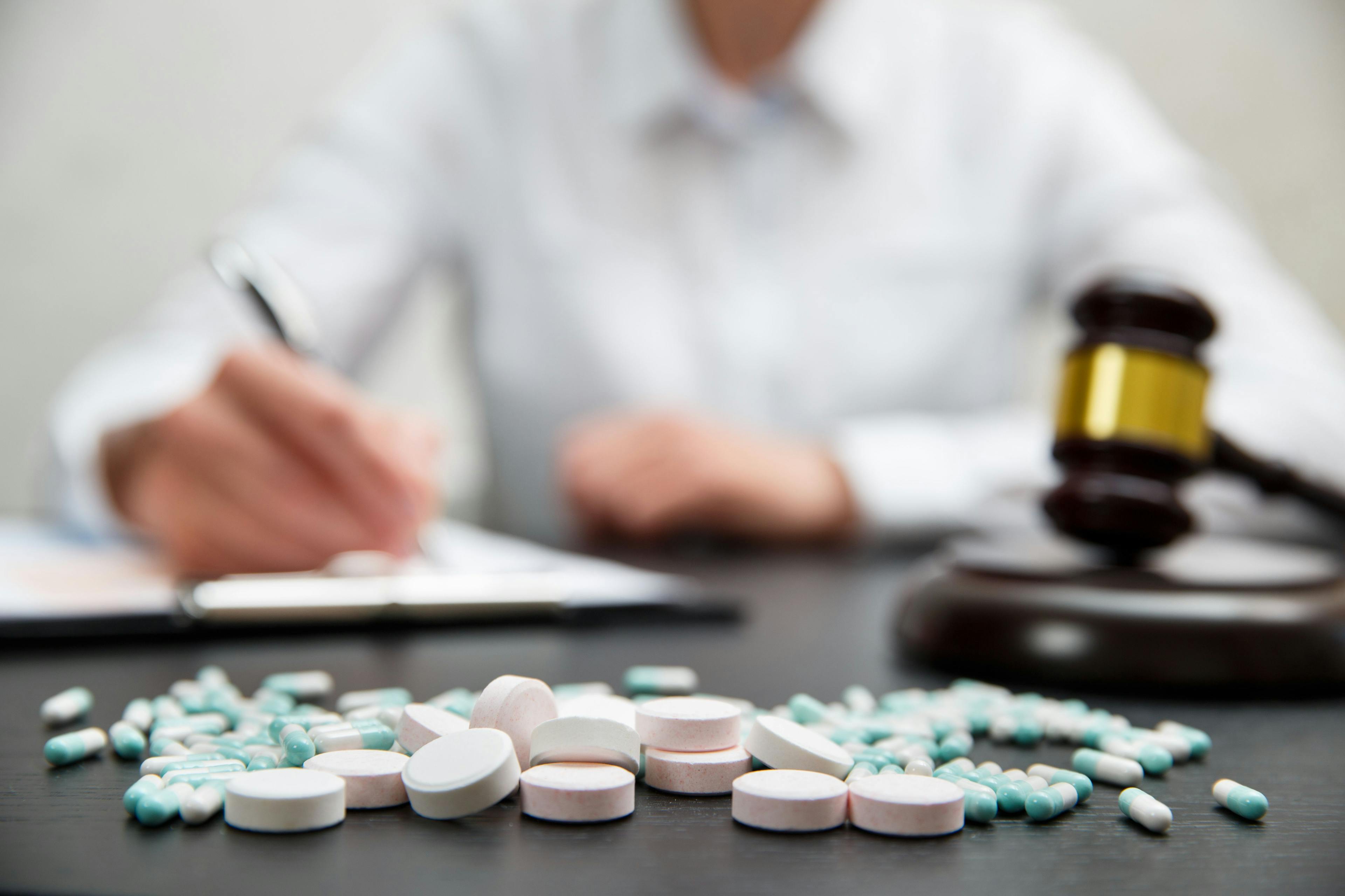 Medicine law concept. Judges gavel with pills - Image credit: Iren Moroz | stock.adobe.com
