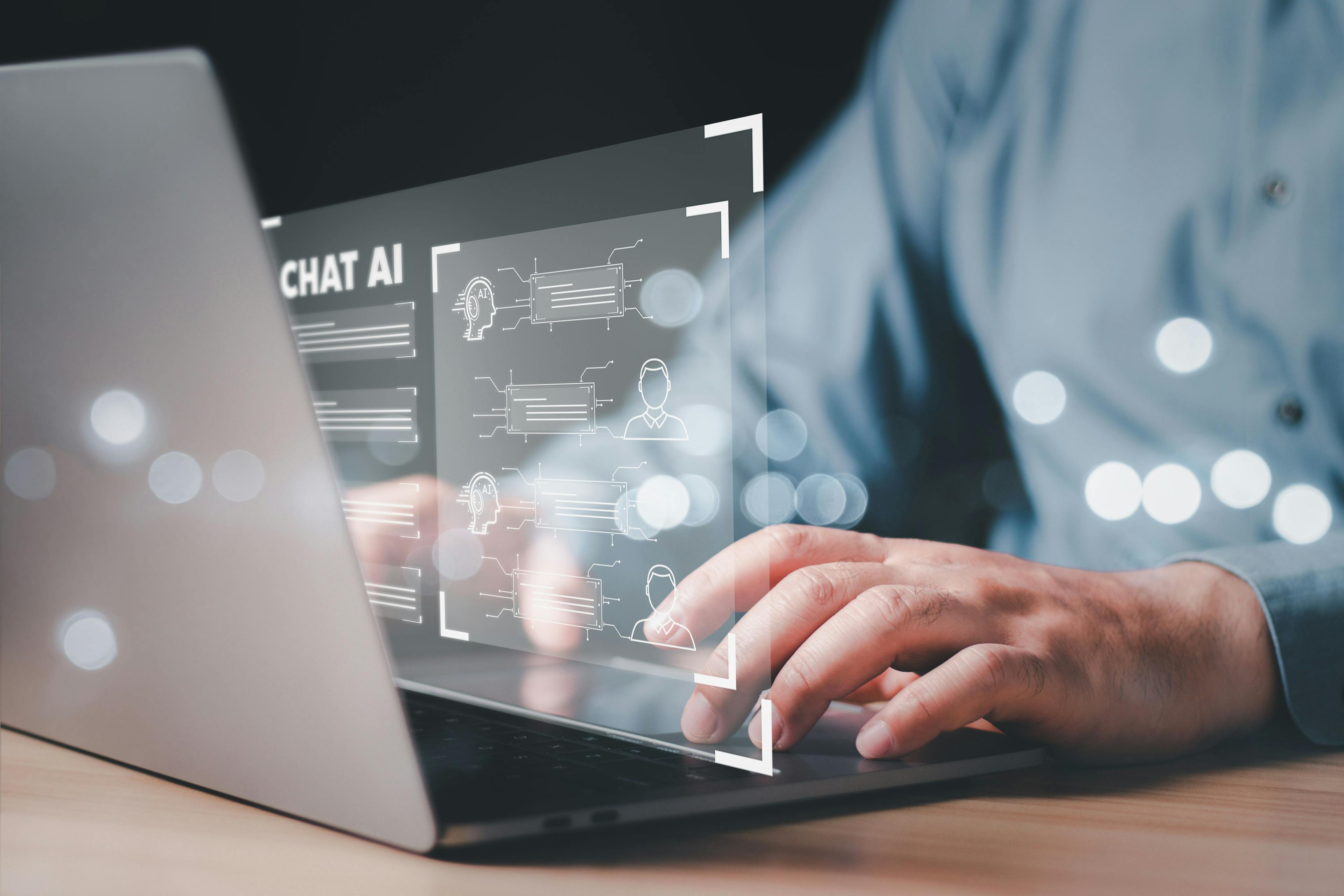 ChatGPT Chat with AI or Artificial Intelligence. businessman chatting with a smart AI or artificial intelligence | Image Credit: wanniwat - stock.adobe.com