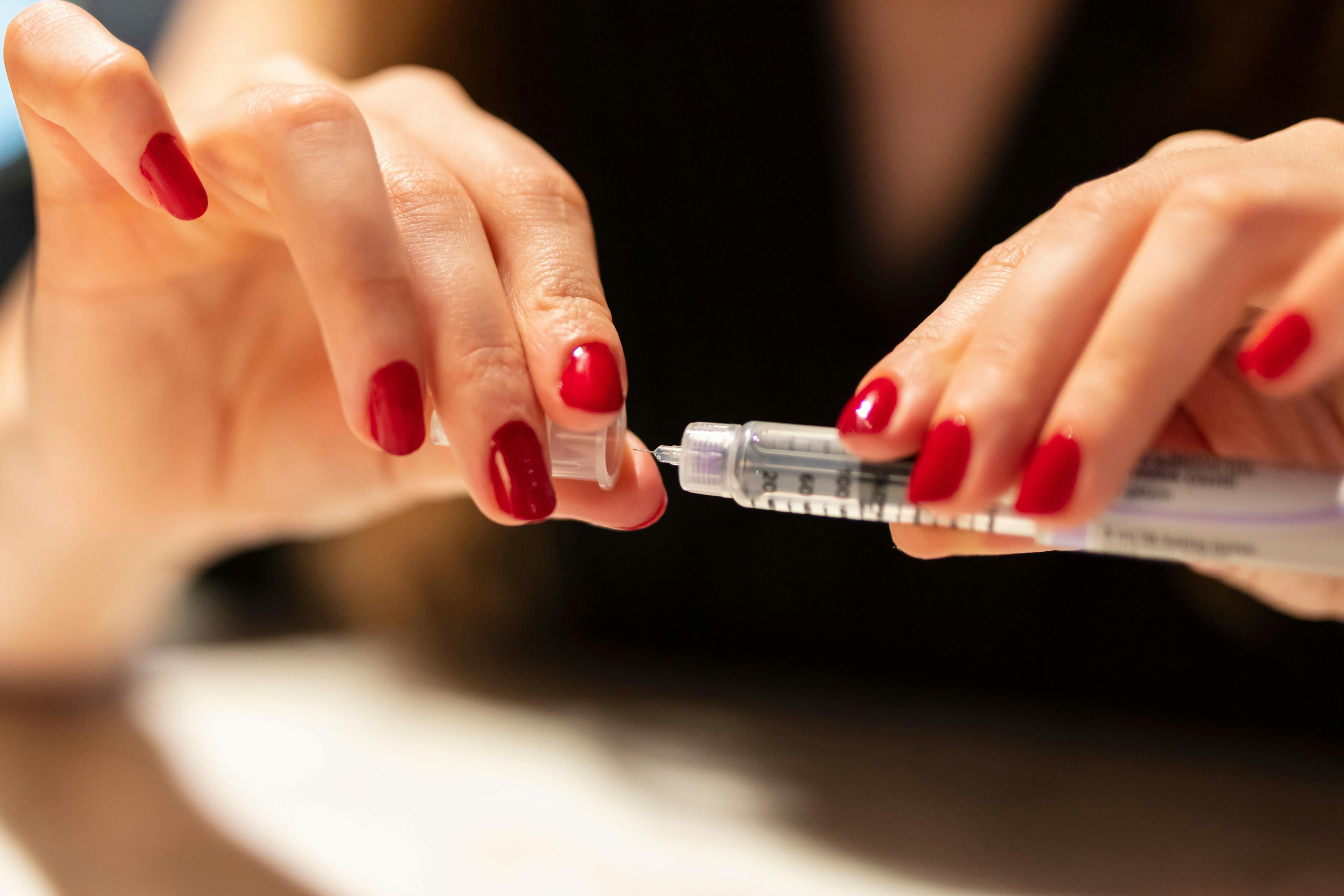 Woman holding an injection pen for diabetic - Image credit: nazif | stock.adobe.com