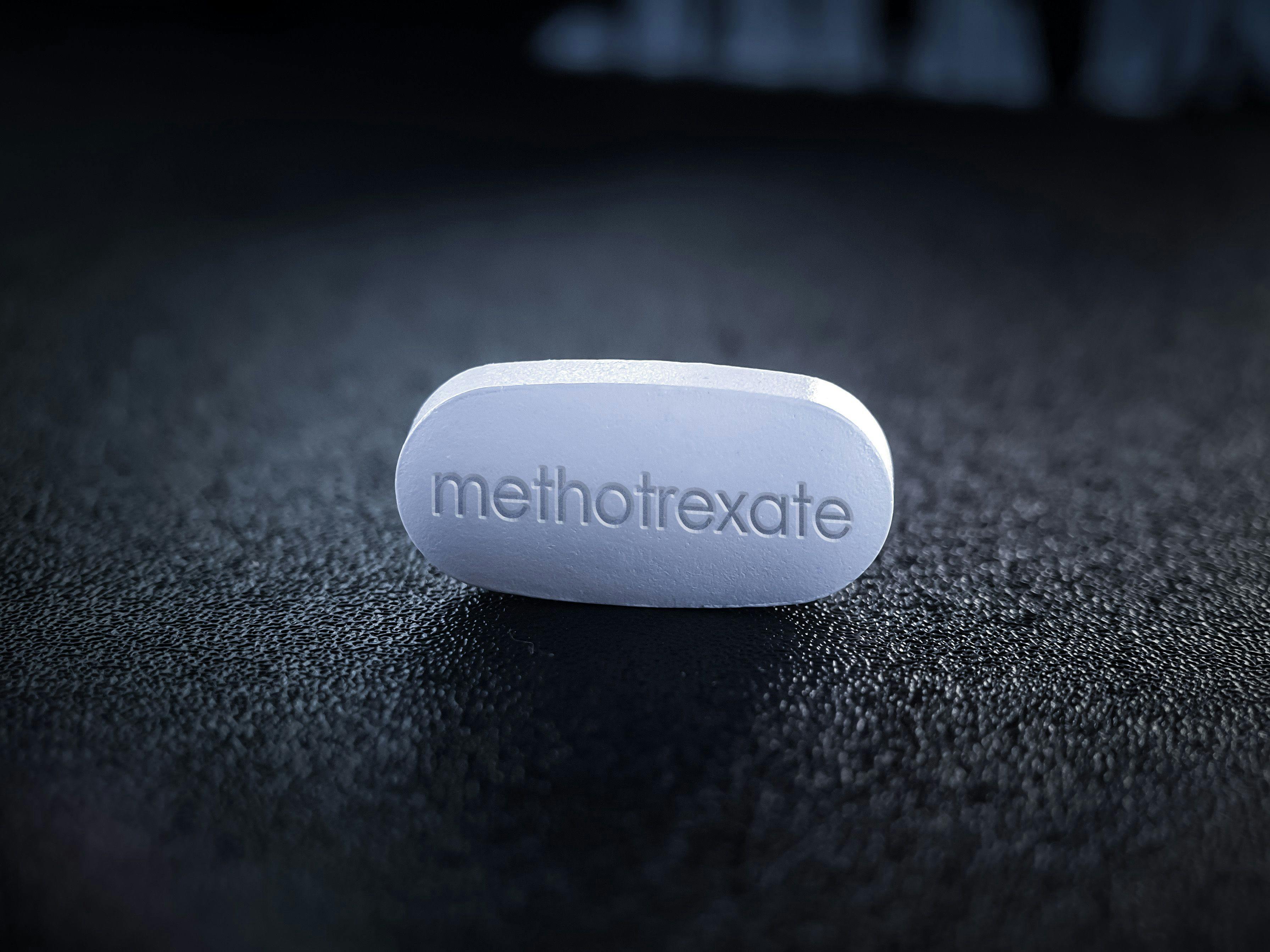 Methotrexate pill on black table - Image credit: Soni's | stock.adobe.com 