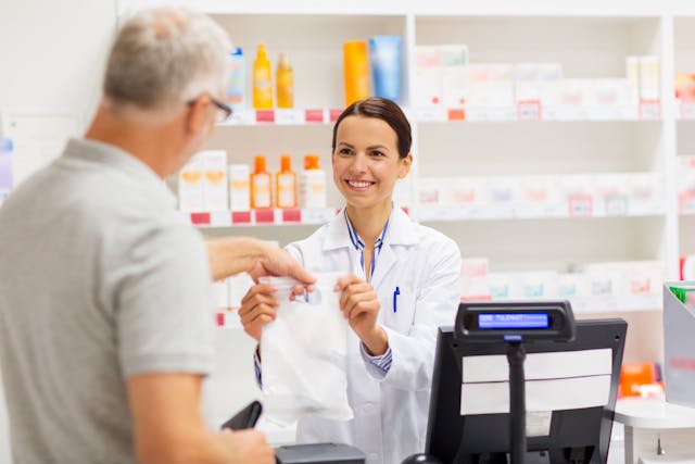 Apothecary selling drug to senior man at pharmacy | Image Credit: Syda Productions - stock.adobe.com
