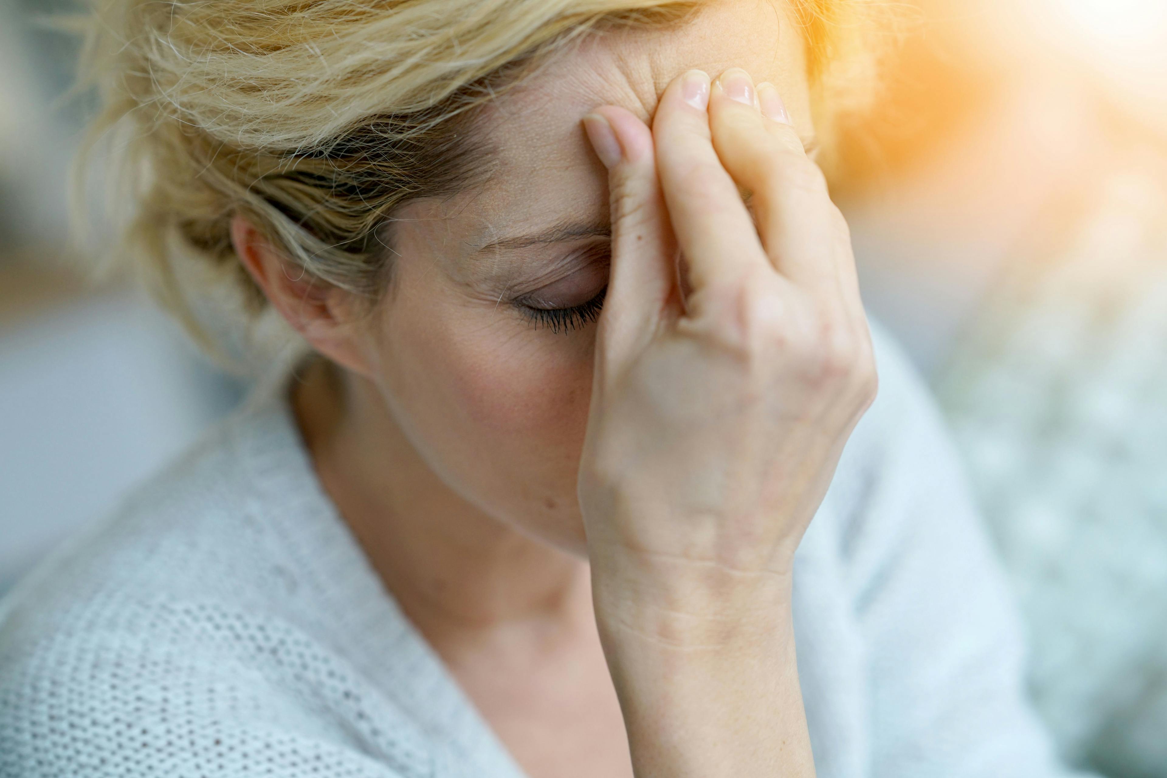 Portrait of middle-aged blond woman having a migraine - Image credit: goodluz | stock.adobe.com