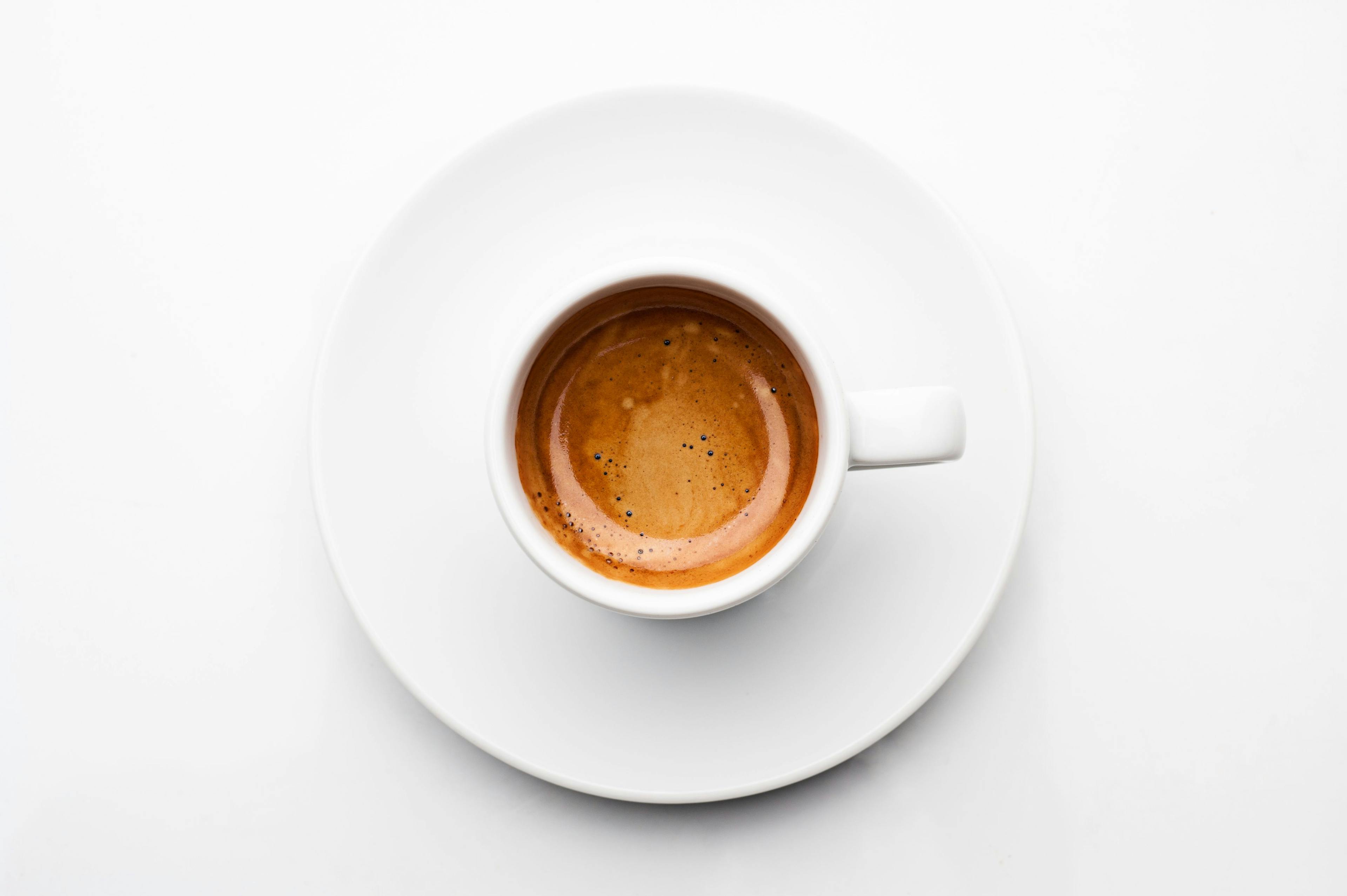 Top view a cup of espresso coffee isolated on white background | Image Credit: joesayhello - stock.adobe.com