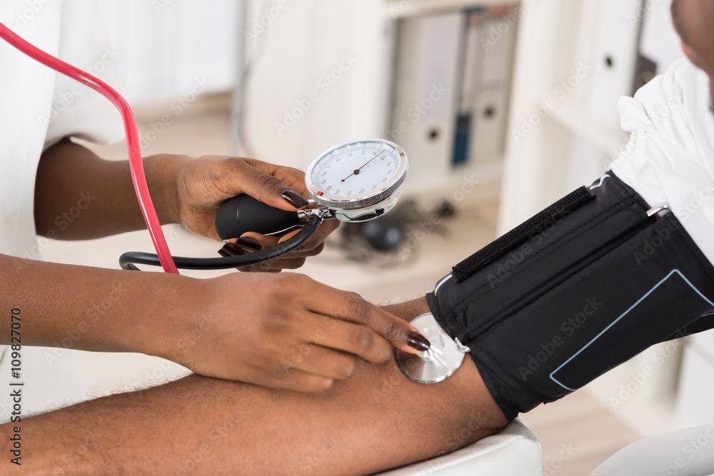 Doctor Measuring Patients Blood Pressure | Image Credit: Andrey Popov - stock.adobe.com