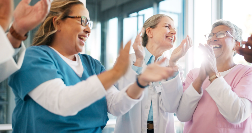 Physicians applauding and supporting team | Image credit: Nina Lawrenson/peopleimages.com - stock.adobe.com
