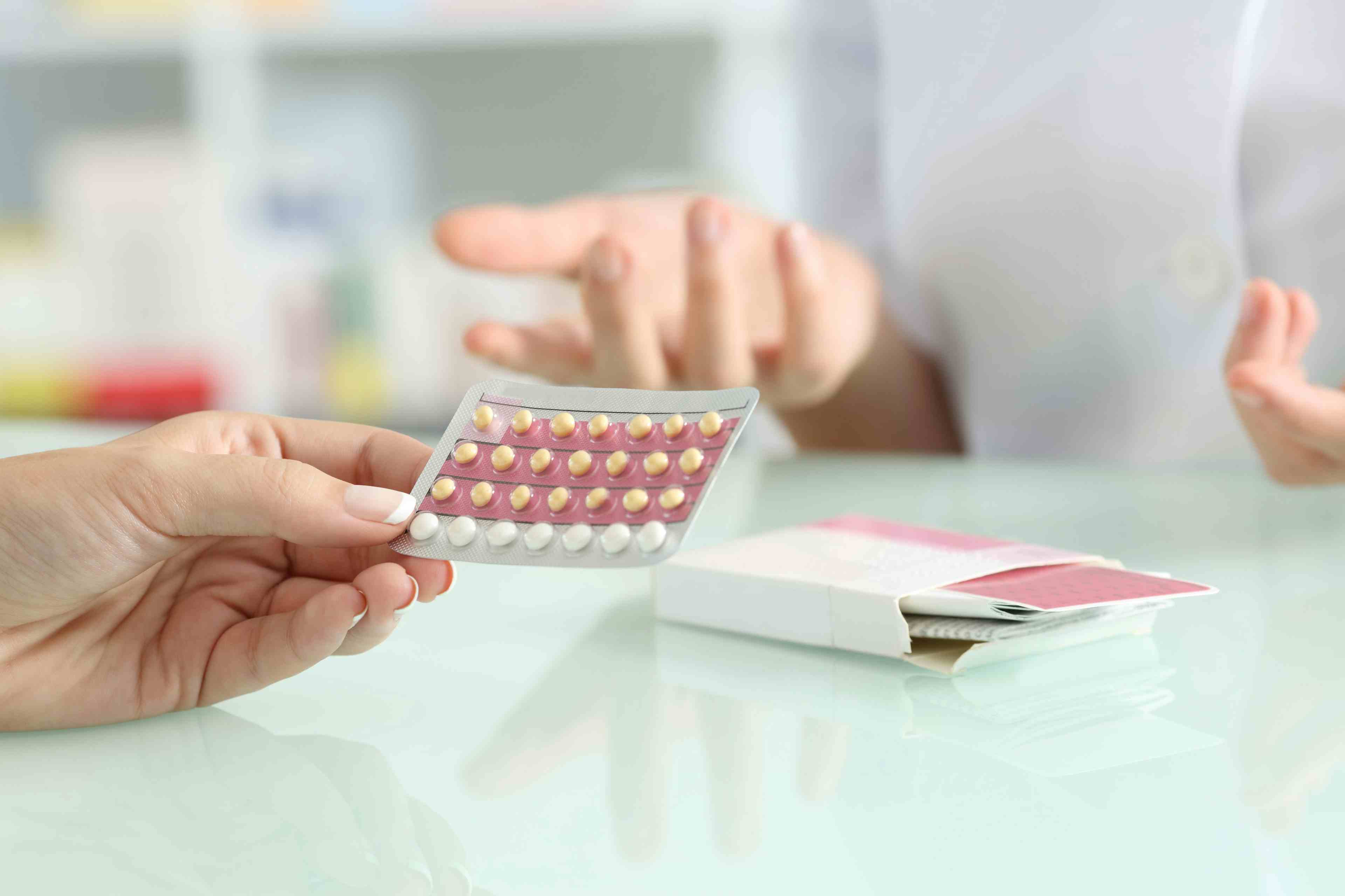 Women buying contraceptive pills in the pharmacy | Image credit: Antonioguillem - stock.adobe.com