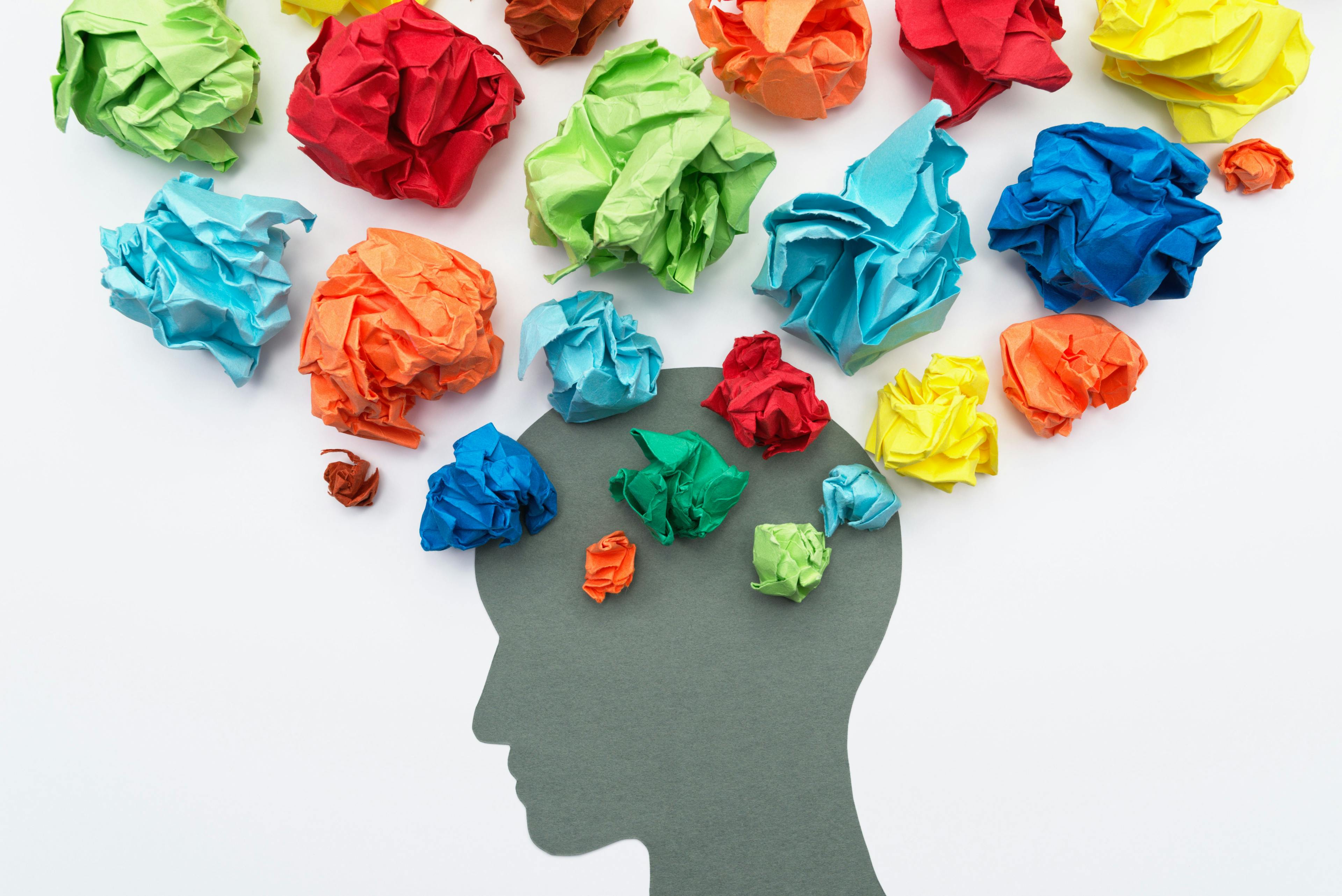 Mental health image. Various emotion and mind. Waste paper and head silhouette. | Image Credit: tadamichi - stock.adobe.com