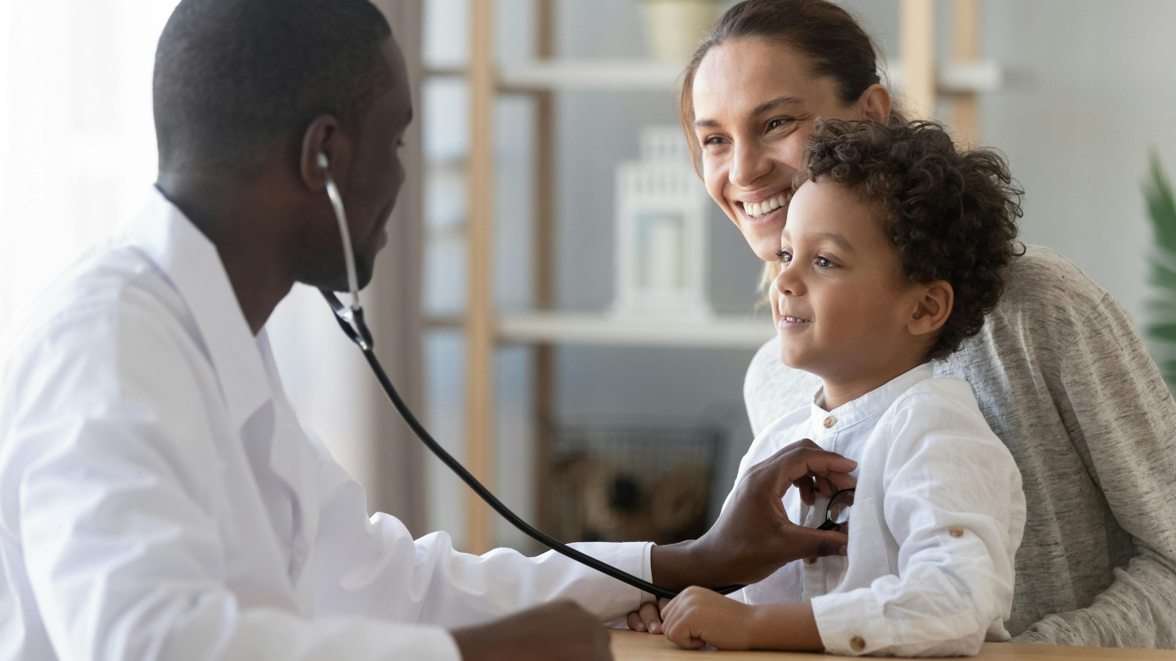 African male pediatrician hold stethoscope exam child boy patient | Image credit: Fizkes - stock.adobe.com