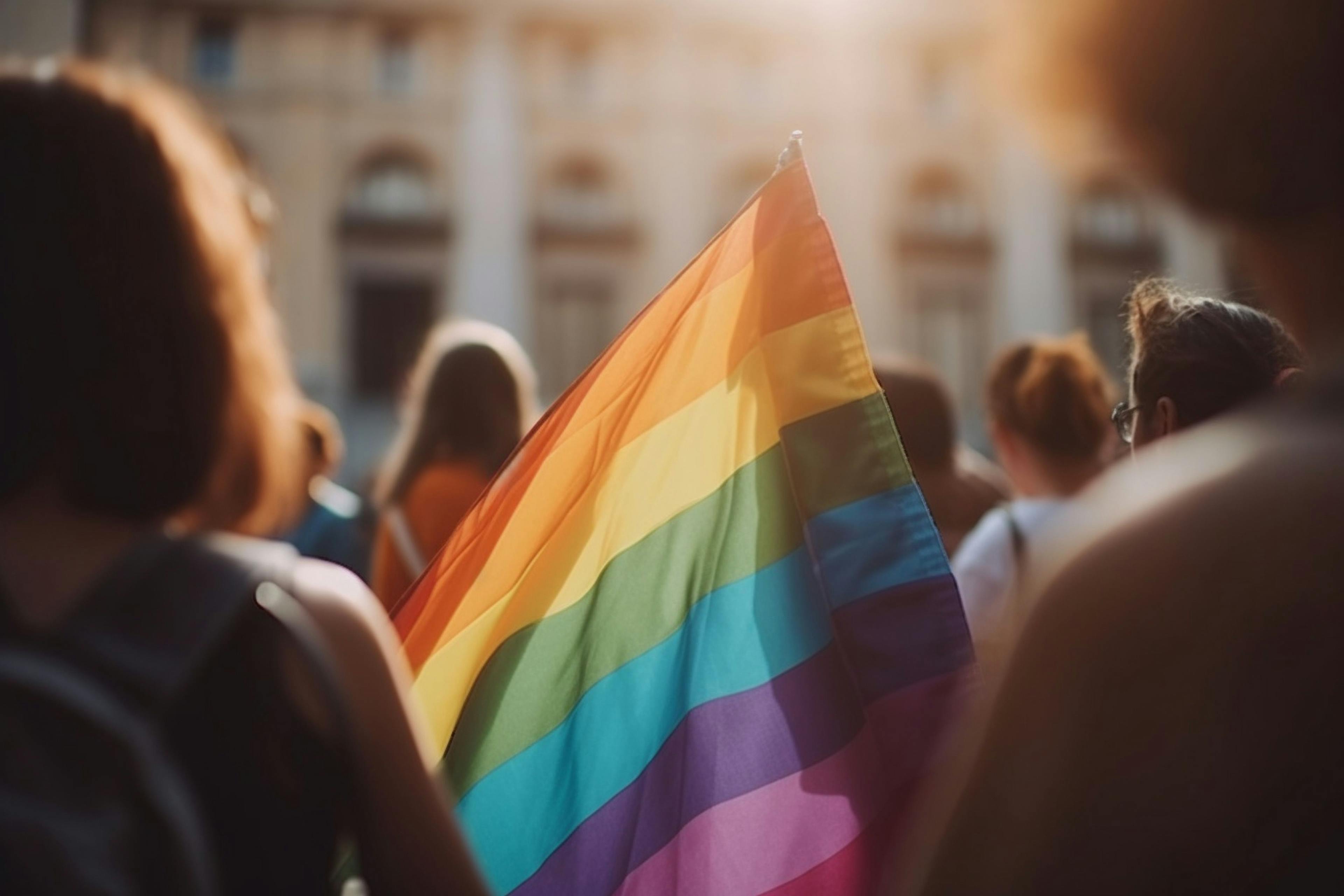LGBT people holding a pride flag | Image credit: Катерина Євтехова - stock.adobe.com