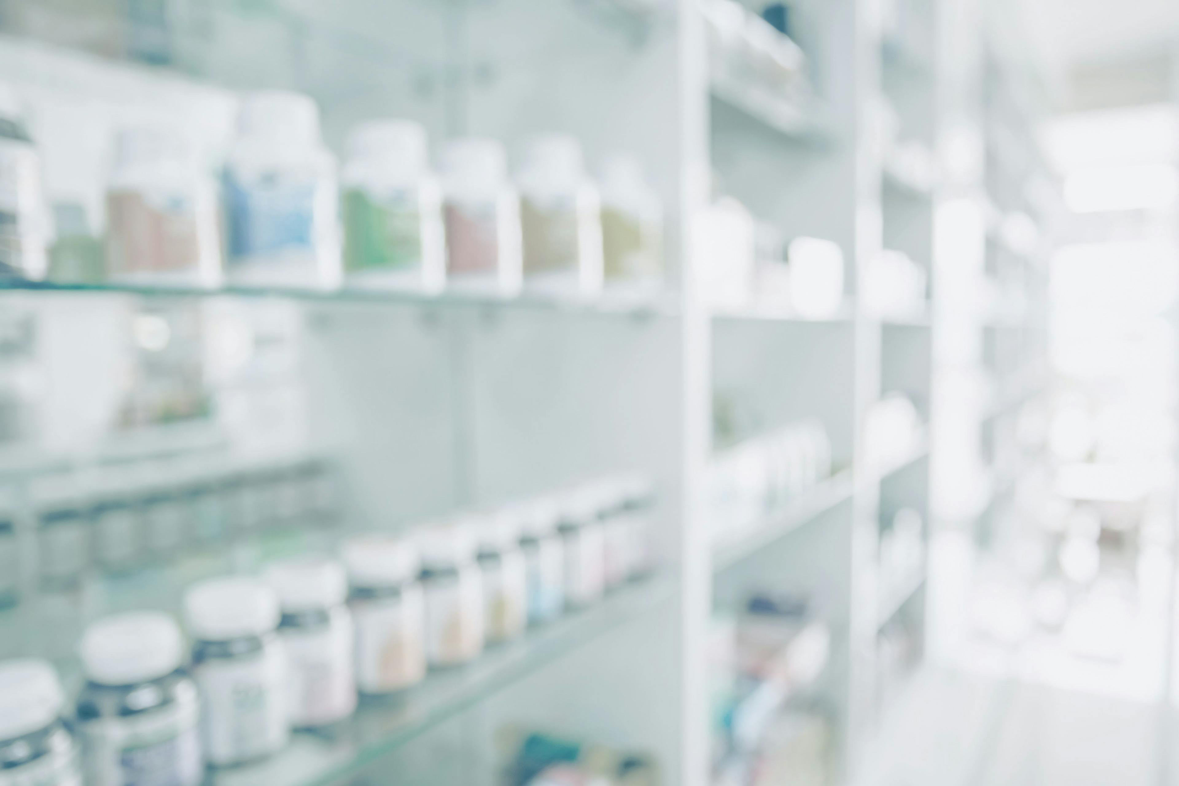 Pharmacy blurred light tone with store drugs shelves interior background | Image Credit: bixpicture - stock.adobe.com