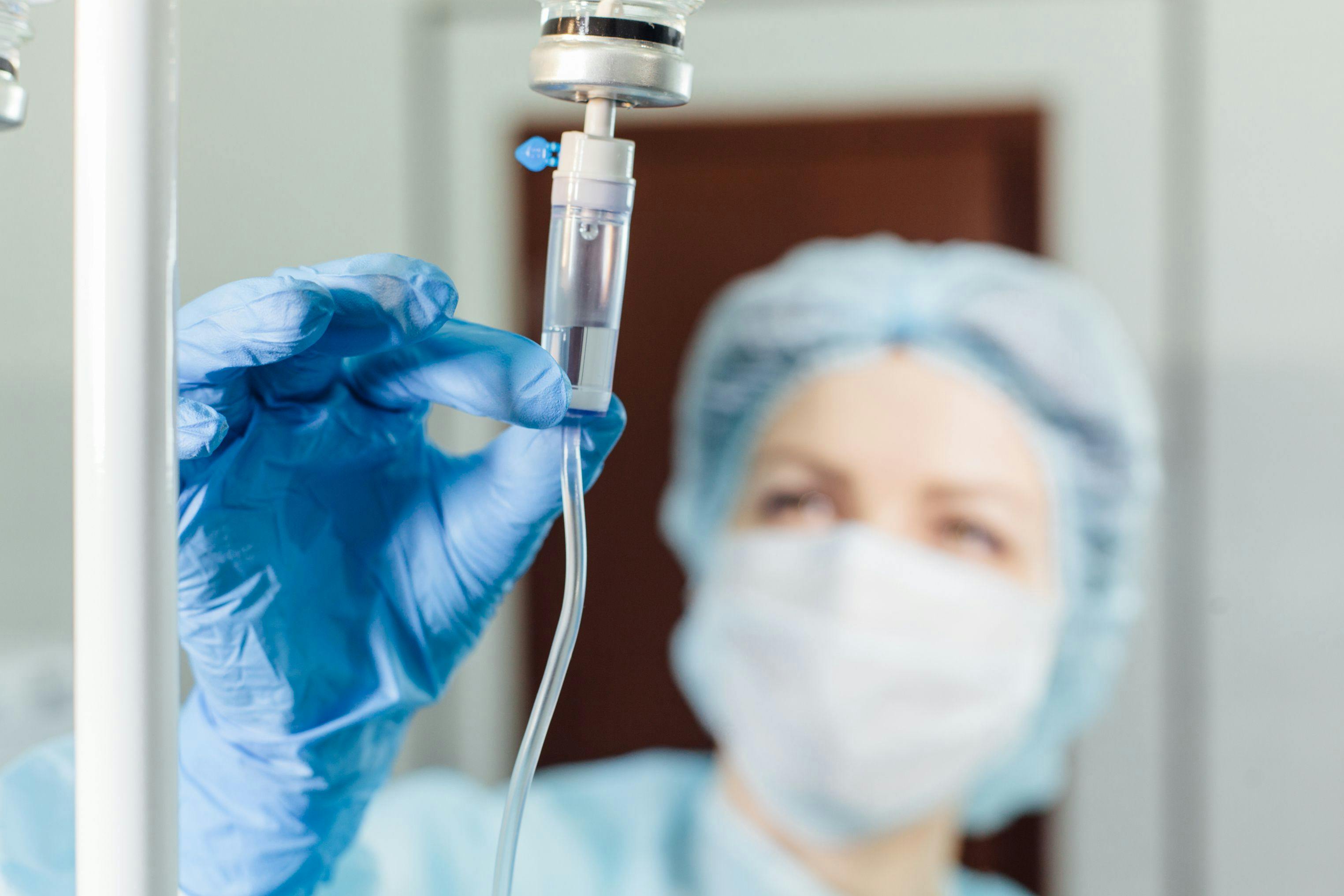 Health care worker preparing an IV drip