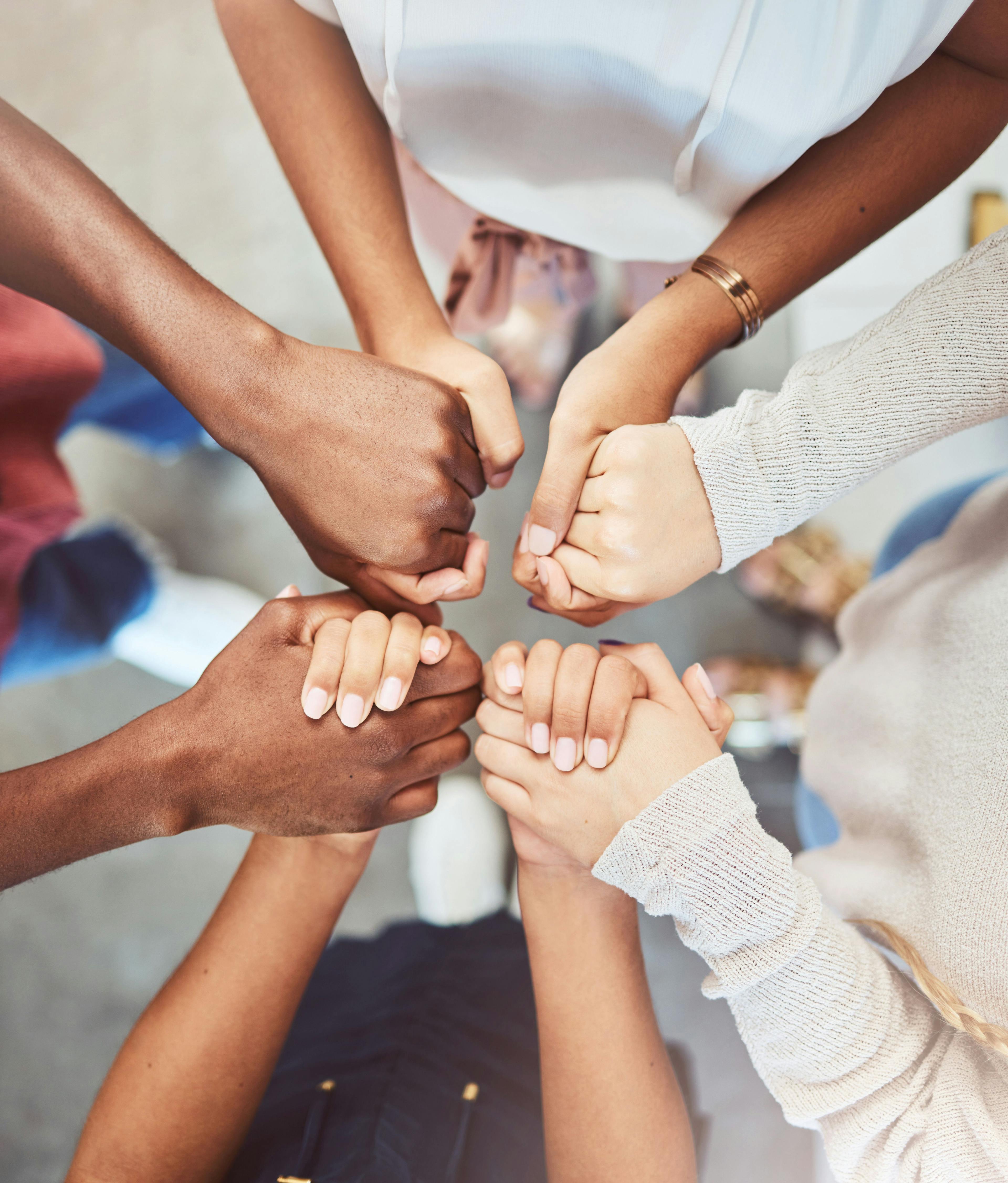 Support, prayer and trust with people holding hands in counseling for mental health, wellness or teamwork. Worship, hope and community group therapy for help, solidarity or spiritual faith from above- Image credit: Mumtaaz Dharsey/peopleimages.com | stock.adobe.com 