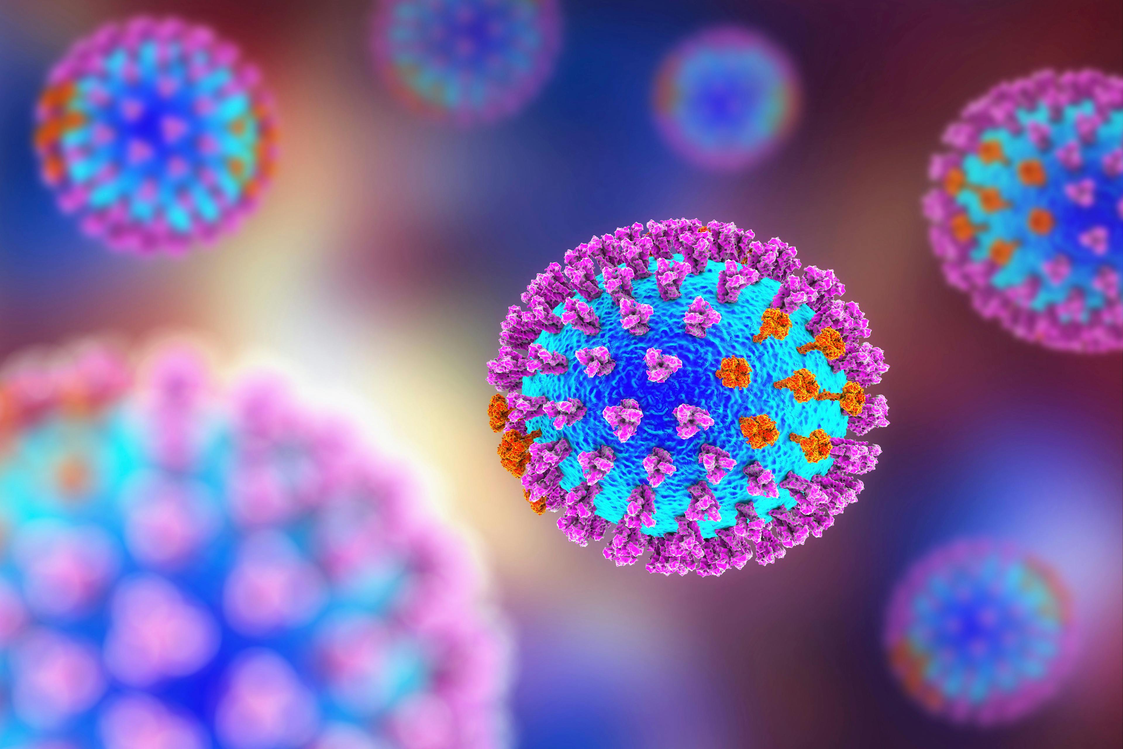 Influenza virus. 3D illustration showing surface glycoprotein spikes hemagglutinin purple and neuraminidase orange | Image Credit: Dr_Microbe - stock.adobe.com