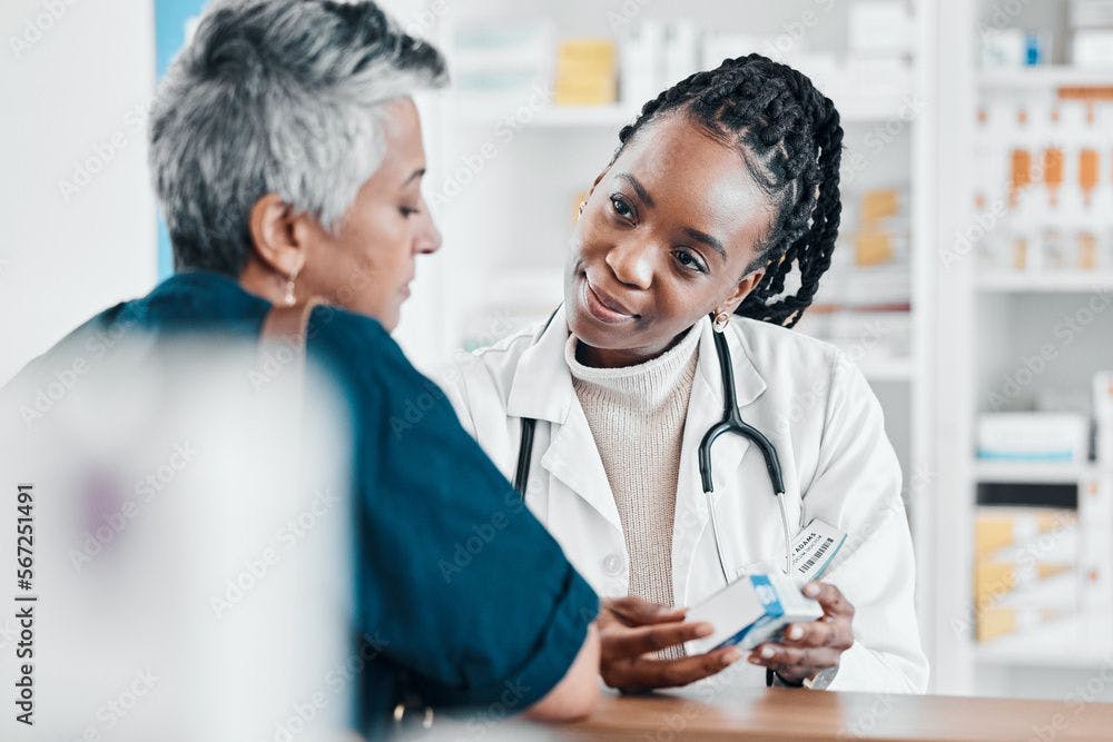 Pills, pharmacy or old woman consulting with a pharmacist for retail healthcare treatment information. Questions, trust or black woman helping a senior woman shopping for medicine or medical drugs | Image Credit: Clayton D/peopleimages.com - stock.adobe.com
