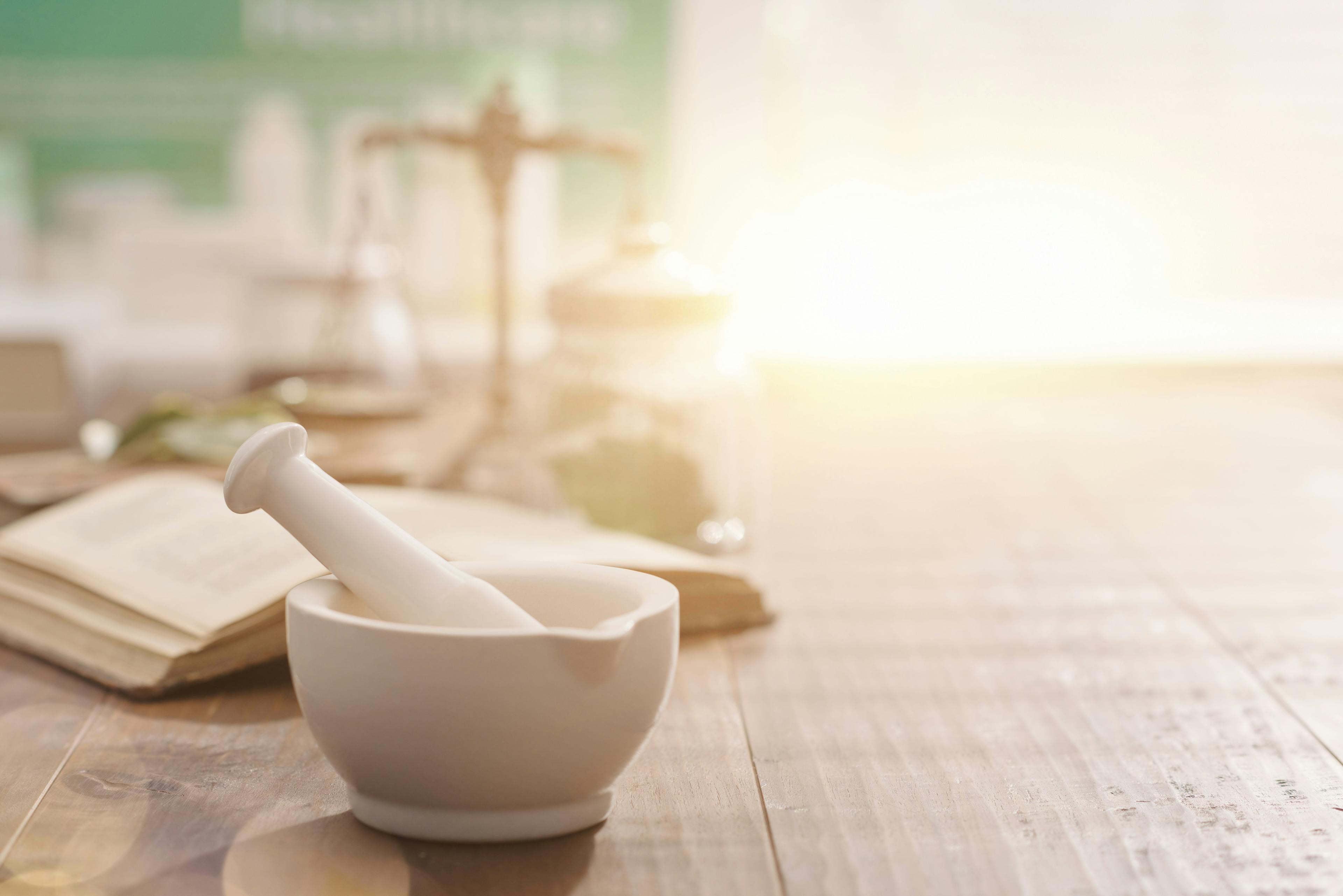 Mortar and pestle on the pharmacist's table- Image credit: StockPhotoPro | stock.adobe.com