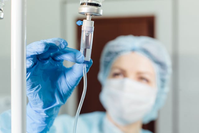 Nurse connecting an intravenous drip -- Image credit: satyrenko | stock.adobe.com