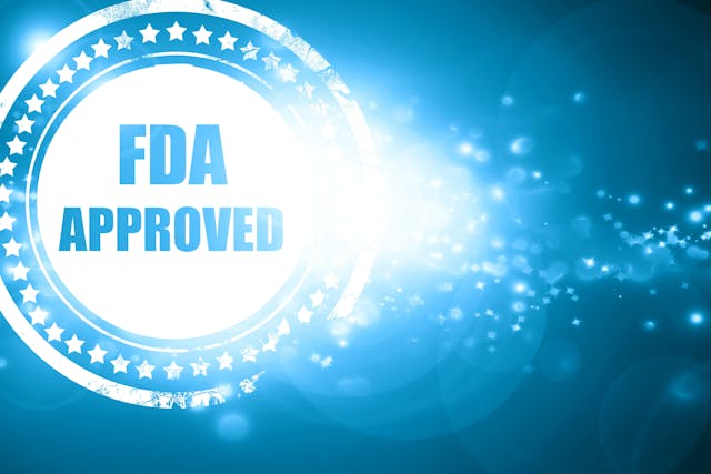 Blue stamp on a glittering background: FDA approved background | Image Credit: Argus - stock.adobe.com
