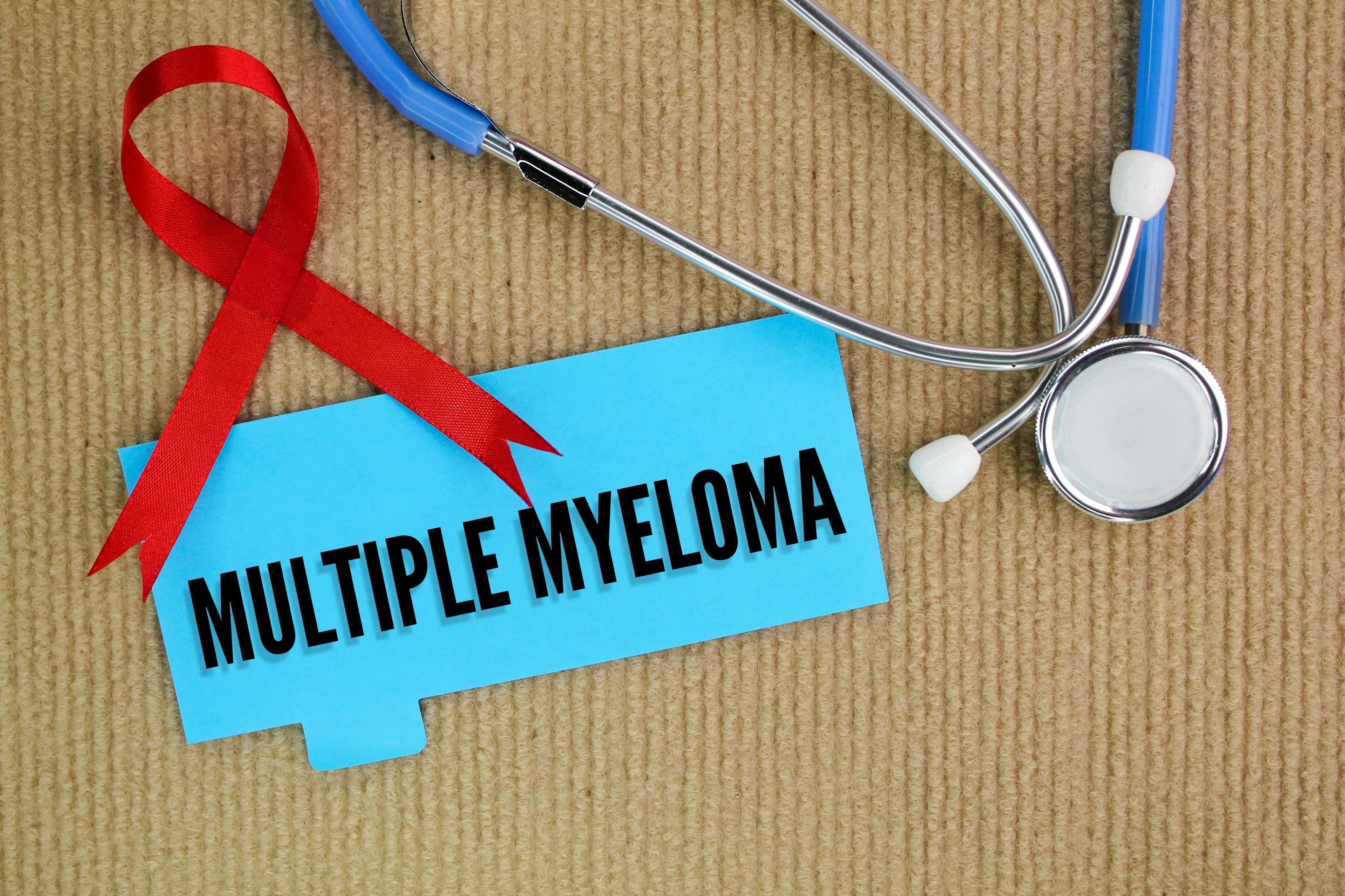 Multiple myeloma, stethoscope, and maroon ribbon -- Image credit: Fauzi | stock.adobe.com