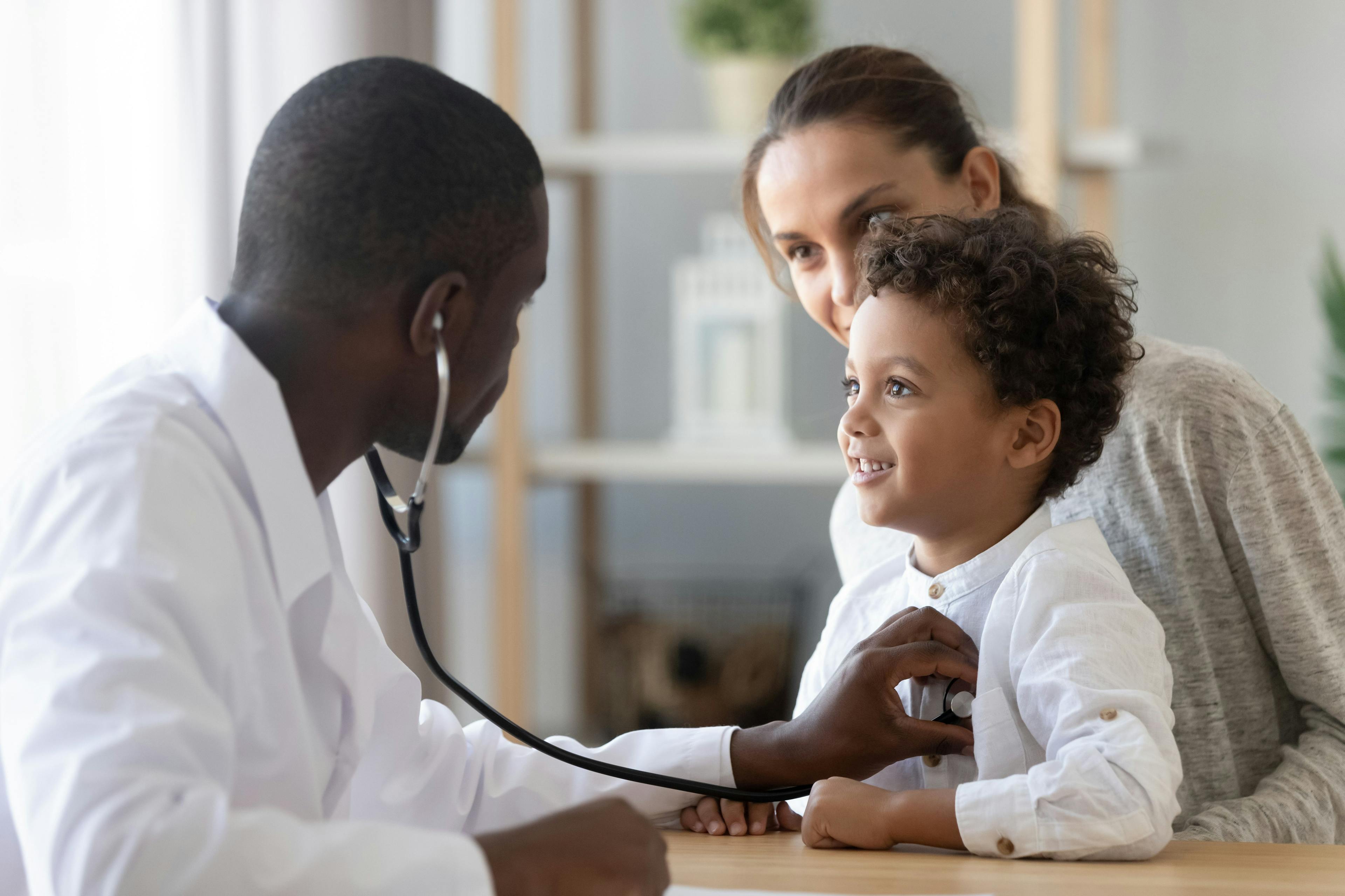 African American pediatrician listening to child lung and heart sound | Image Credit: fizkes - stock.adobe.com