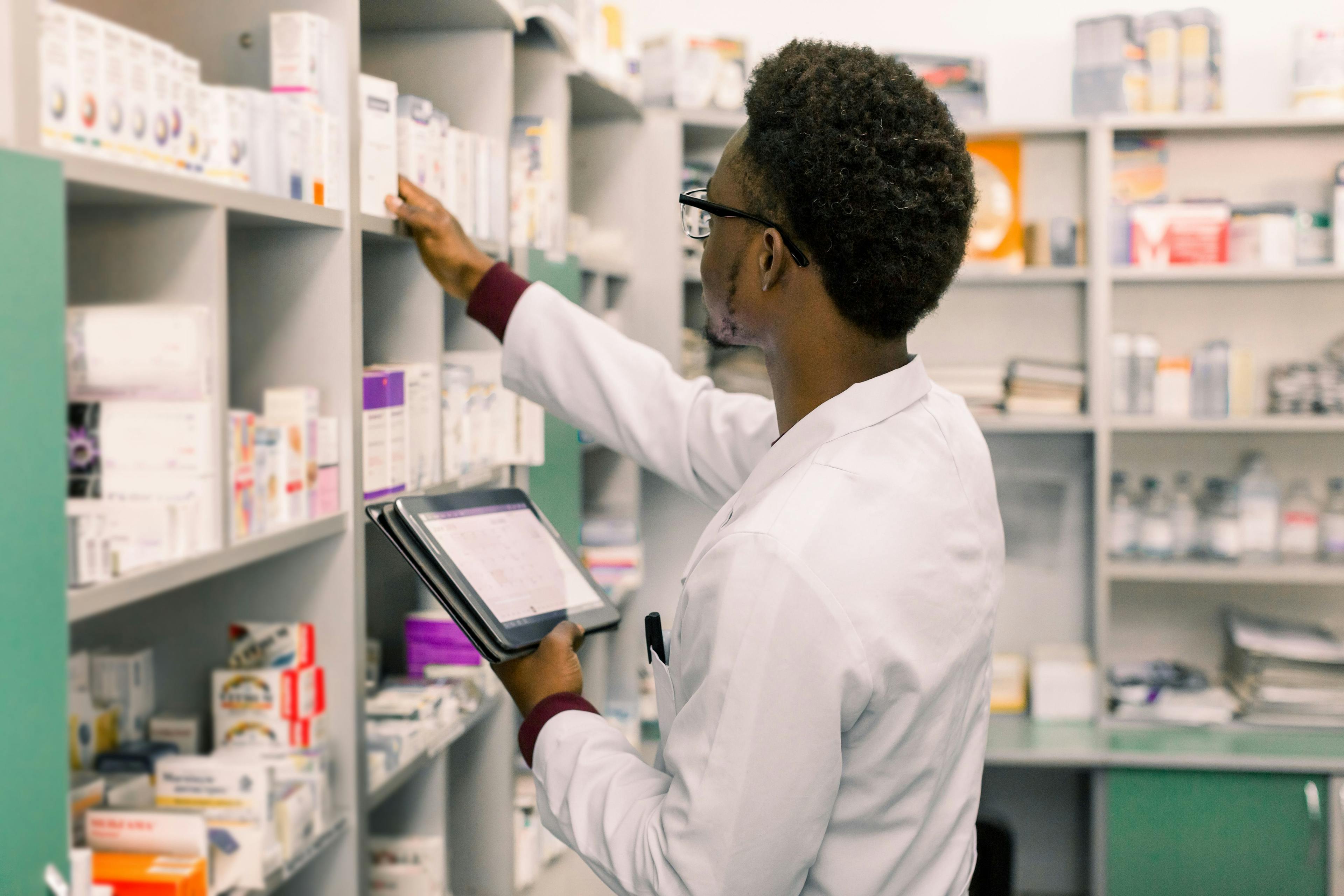 Male pharmacist using digital tablet during inventory in pharmacy | Image Credit: sofiko14 - stock.adobe.com