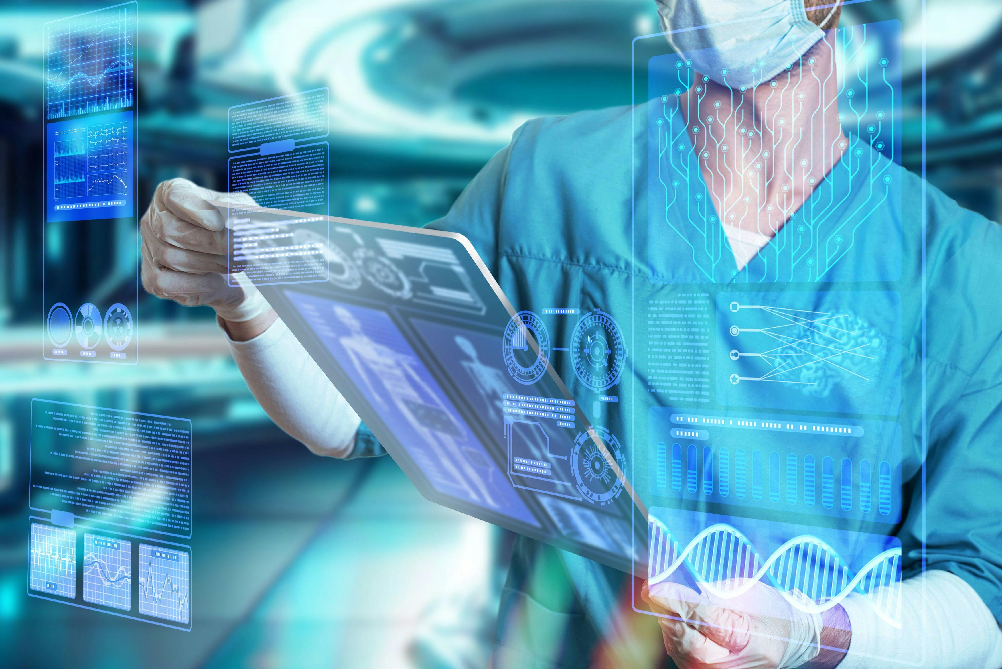 Doctor surgeon in medical apparel working with Futuristic Holographic Interface, showing medical Data in augmented reality from artificial intelligence AI | Image credit: TSViPhoto- stock.adobe.com