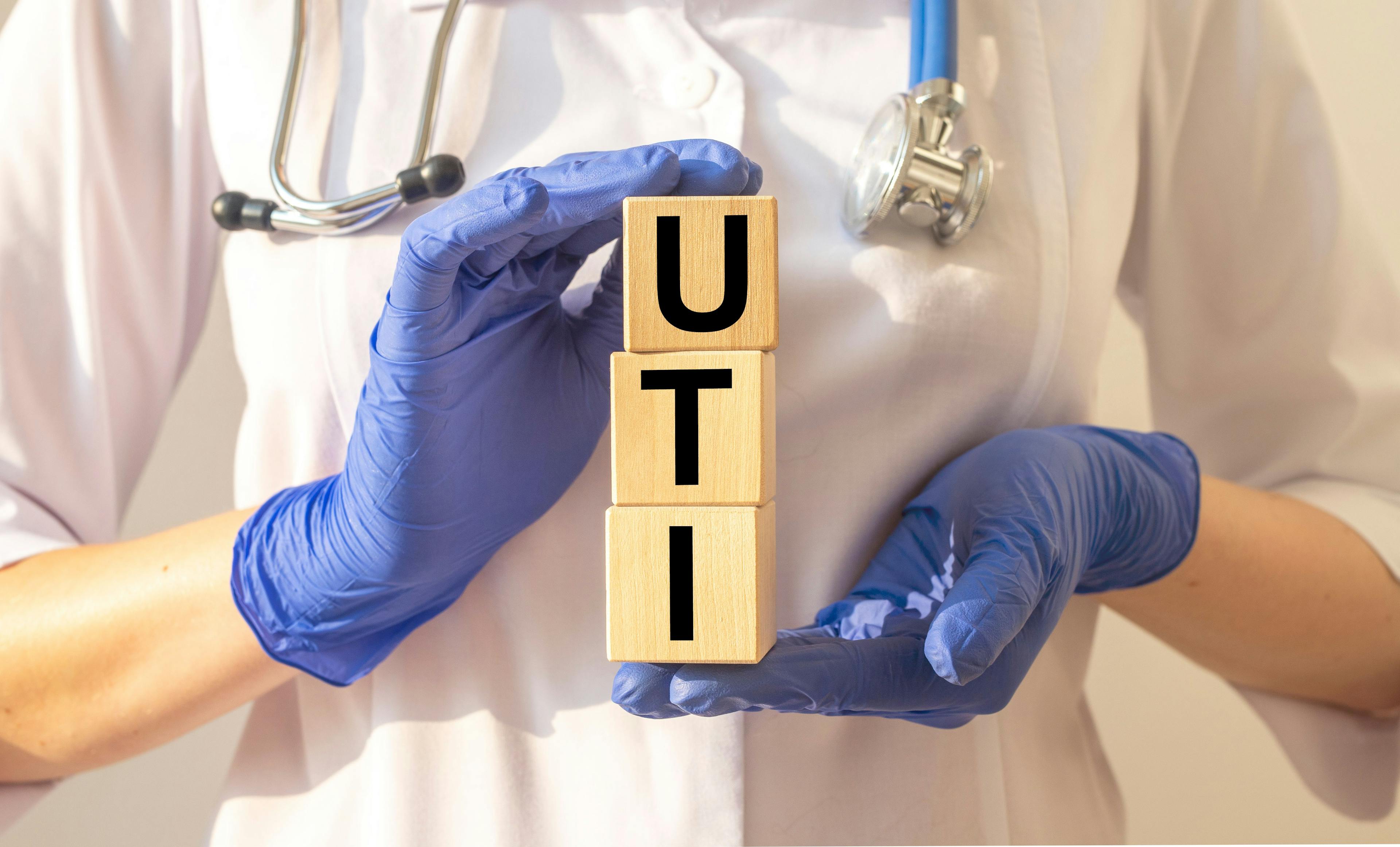 Word uti concept, urinary tract infection inscription on cubes in doctor hands | Image Credit: valiantsin - stock.adobe.com