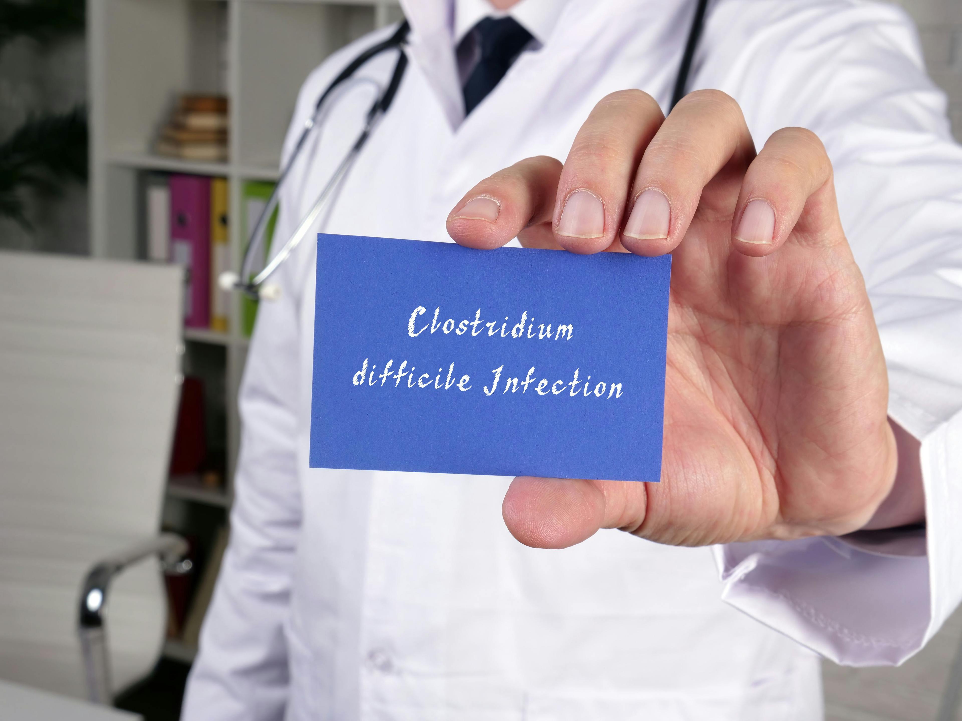 Health care concept meaning Clostridium difficile Infection with phrase on the piece of paper. | Image Credit: Yurii Kibalnik - stock.adobe.com