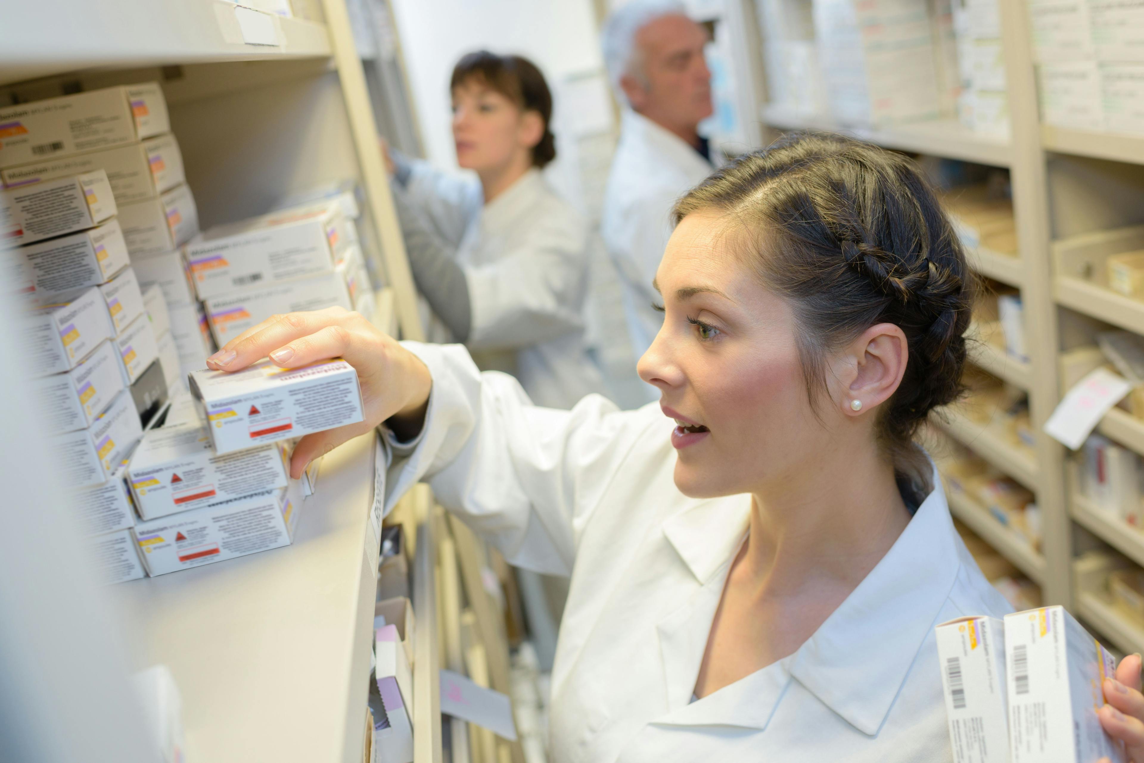 Pharmacy technician helping around pharmacy | Image Credit: auremar - stock.adobe.com