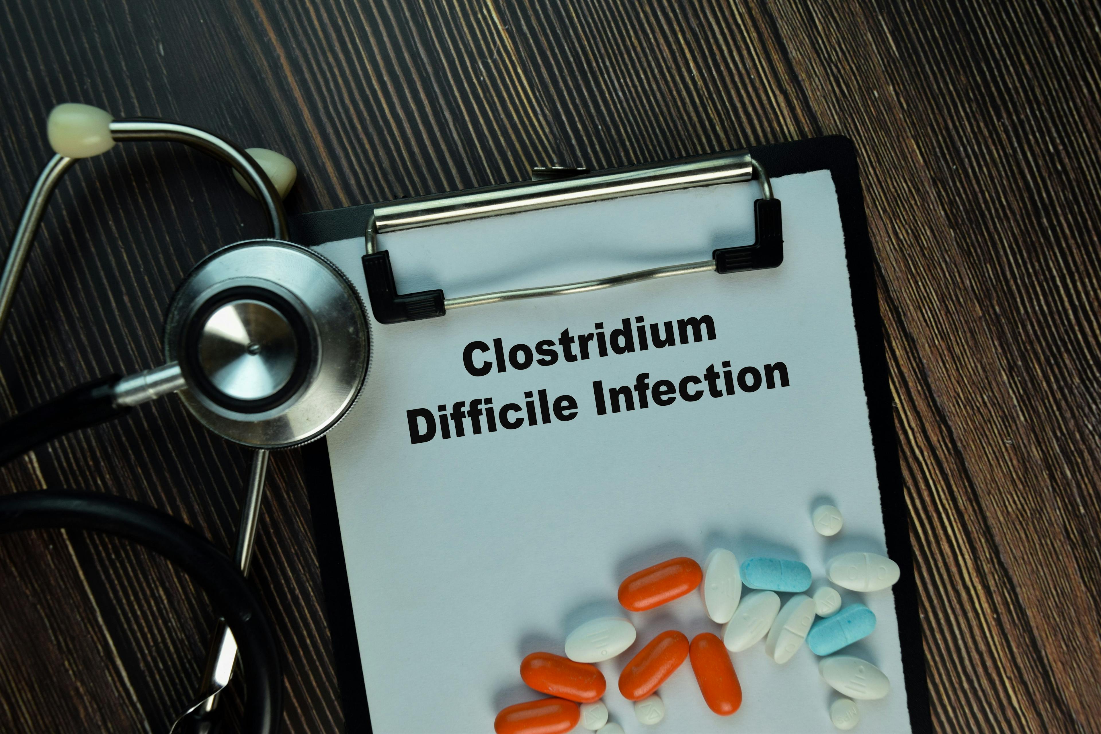 Clostridium Difficile Infection write on sticky notes isolated on Wooden Table. Medical or Healthcare concept | Image Credit: syahrir - stock.adobe.com