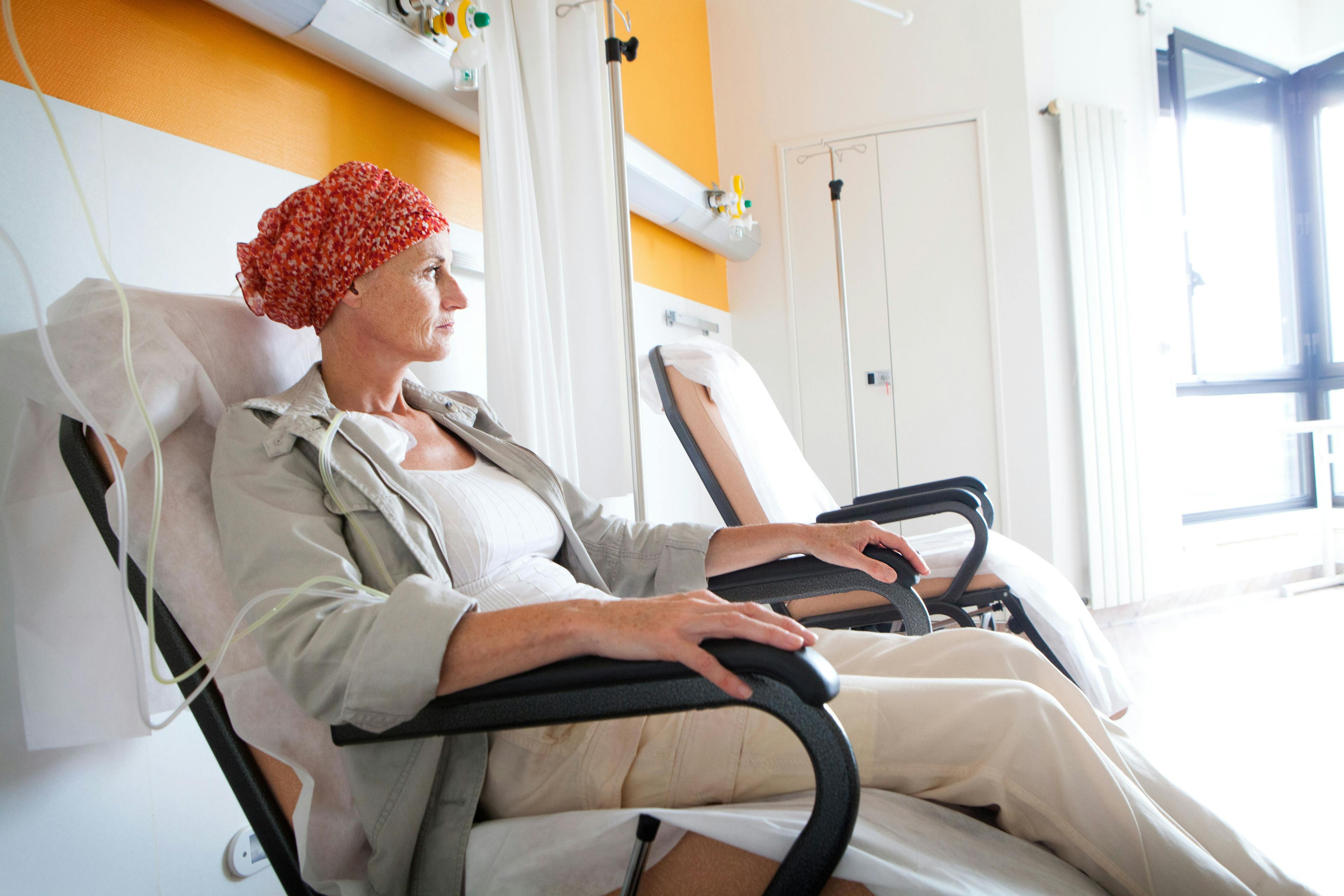Woman receiving ambulatory chemotherapy in a recliner with an IV
