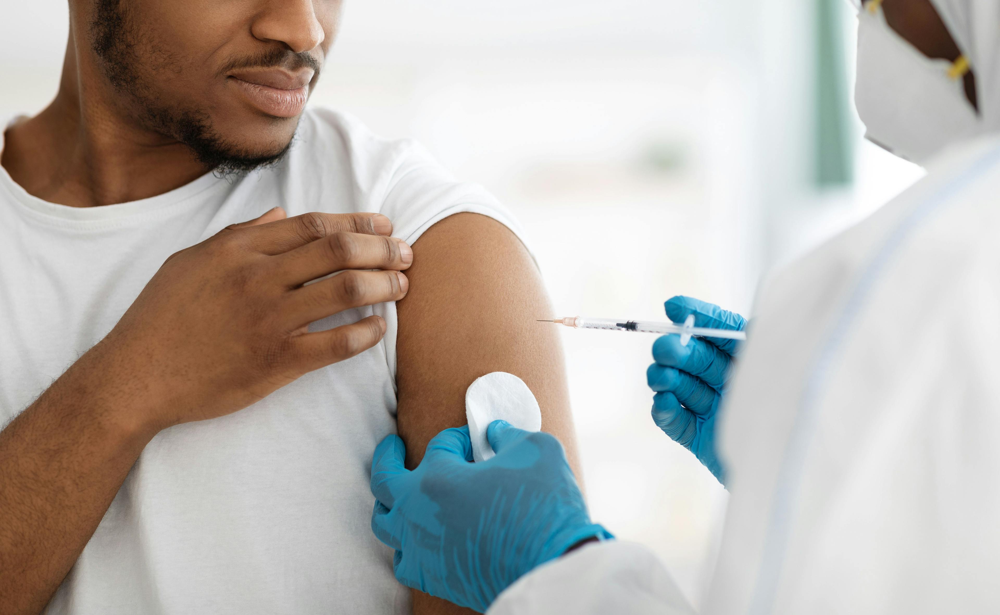 Cropped of black man receiving vaccine shot | Image Credit: Prostock-studio - stock.adobe.com