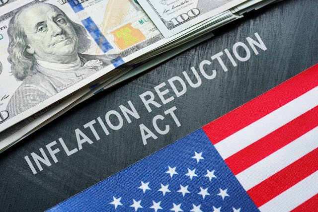 USA flag, dollars and inscription inflation reduction act. | Vitalii Vodolazskyi - stock.adobe.com