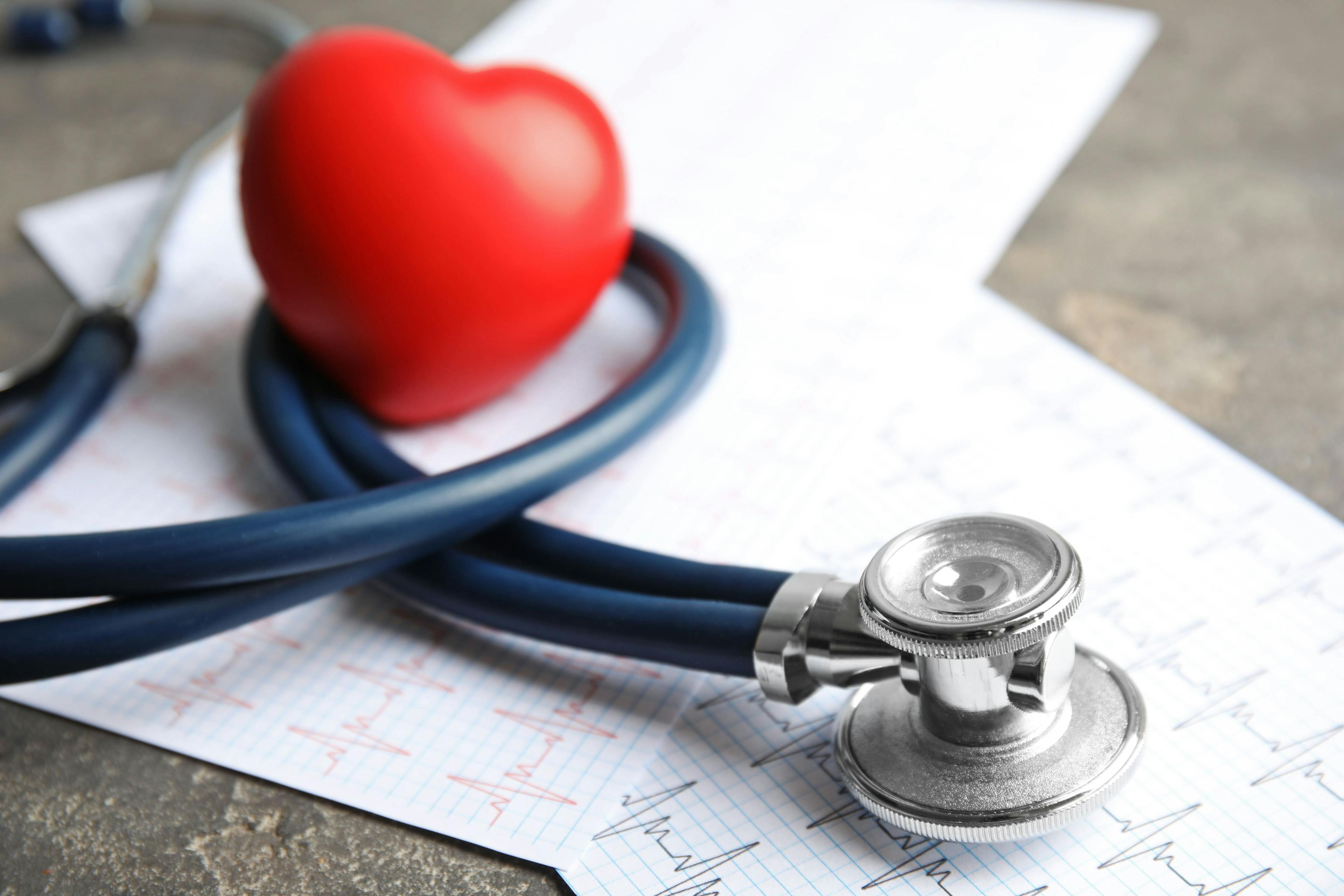 Stethoscope, red heart and cardiogram on gray table. Cardiology concept | Image Credit: New Africa - stock.adobe.com