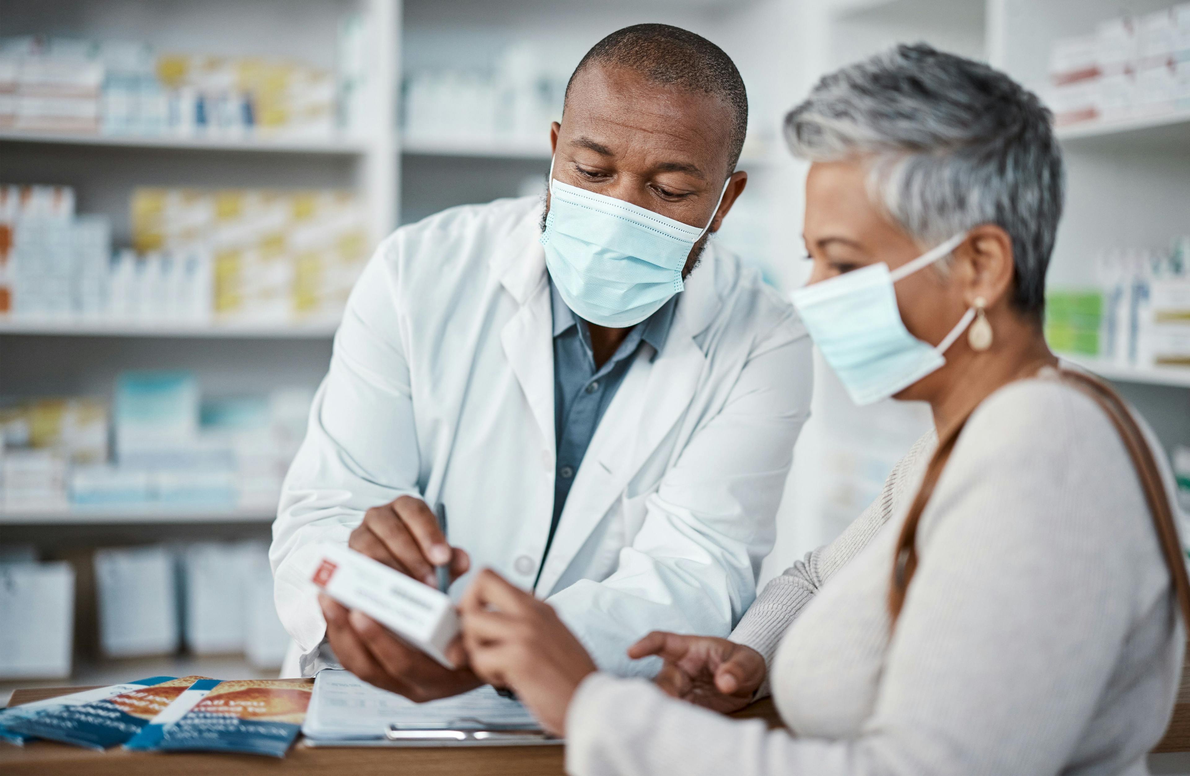 Pharmacist talking, helping or giving medical advice | Image Credit: C Daniels/peopleimages.com - stock.adobe.com
